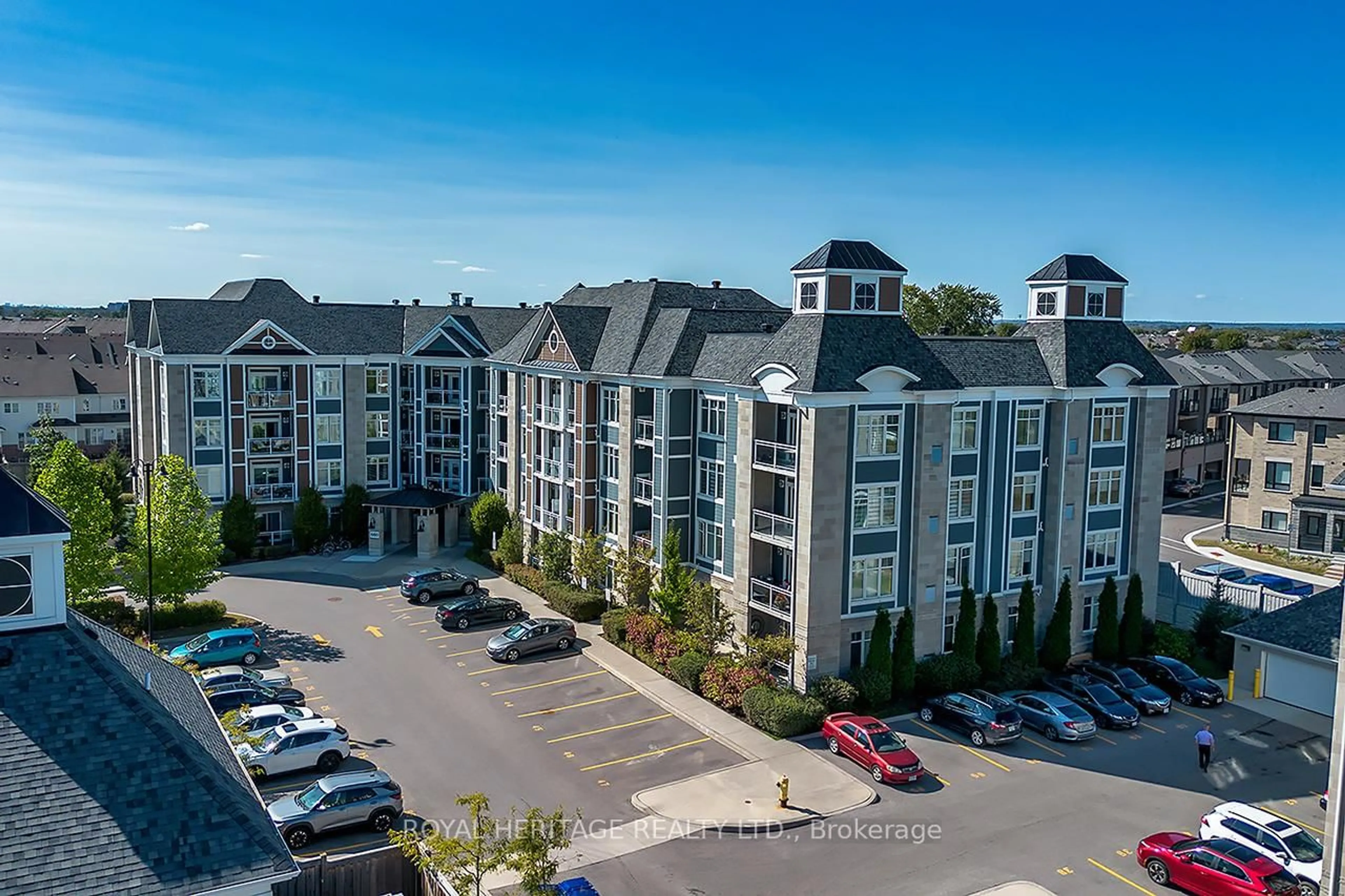 A pic from outside/outdoor area/front of a property/back of a property/a pic from drone, unknown for 660 Gordon St #313, Whitby Ontario L1N 0L1