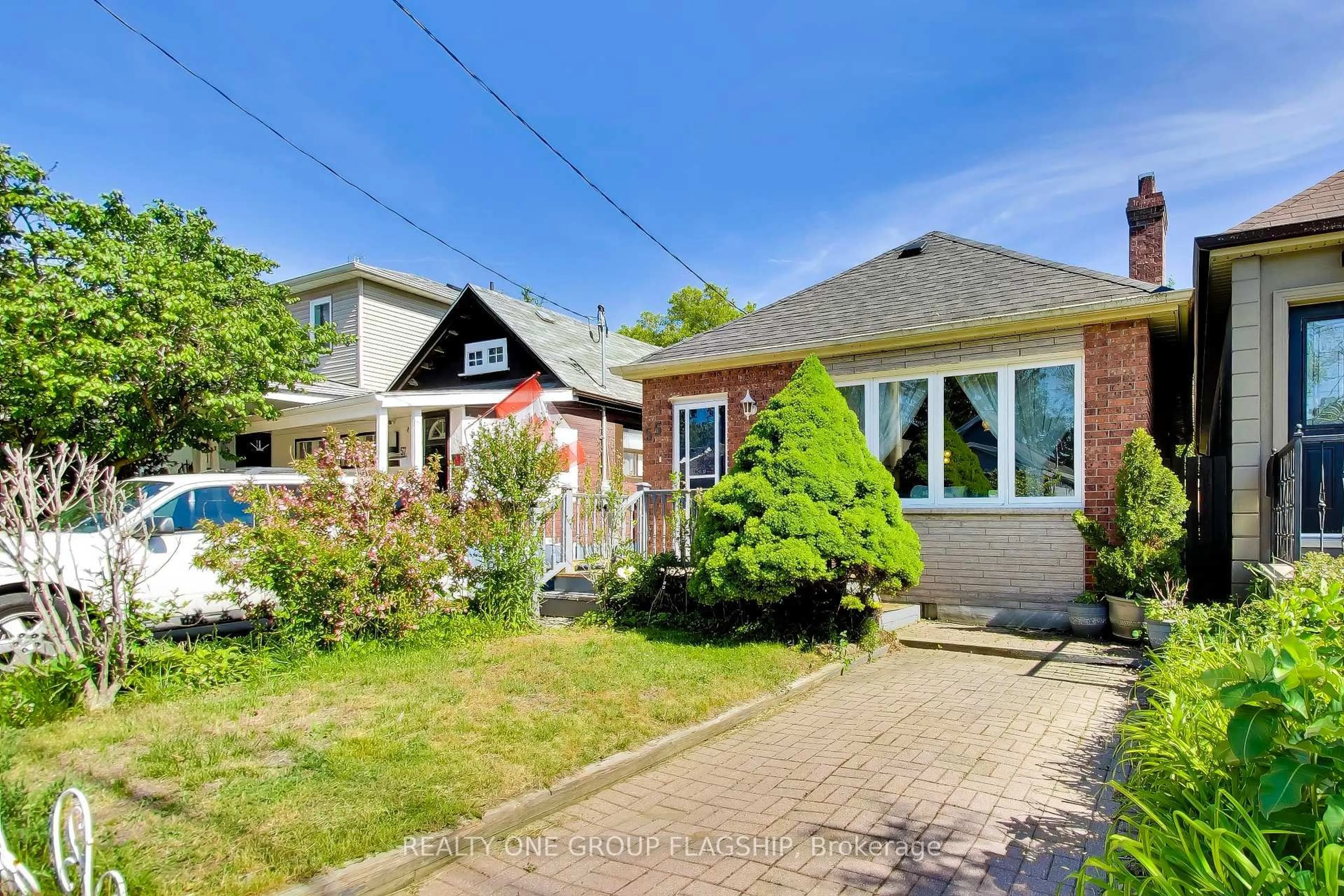 Home with brick exterior material, street for 55 Frater Ave, Toronto Ontario M4C 2H5