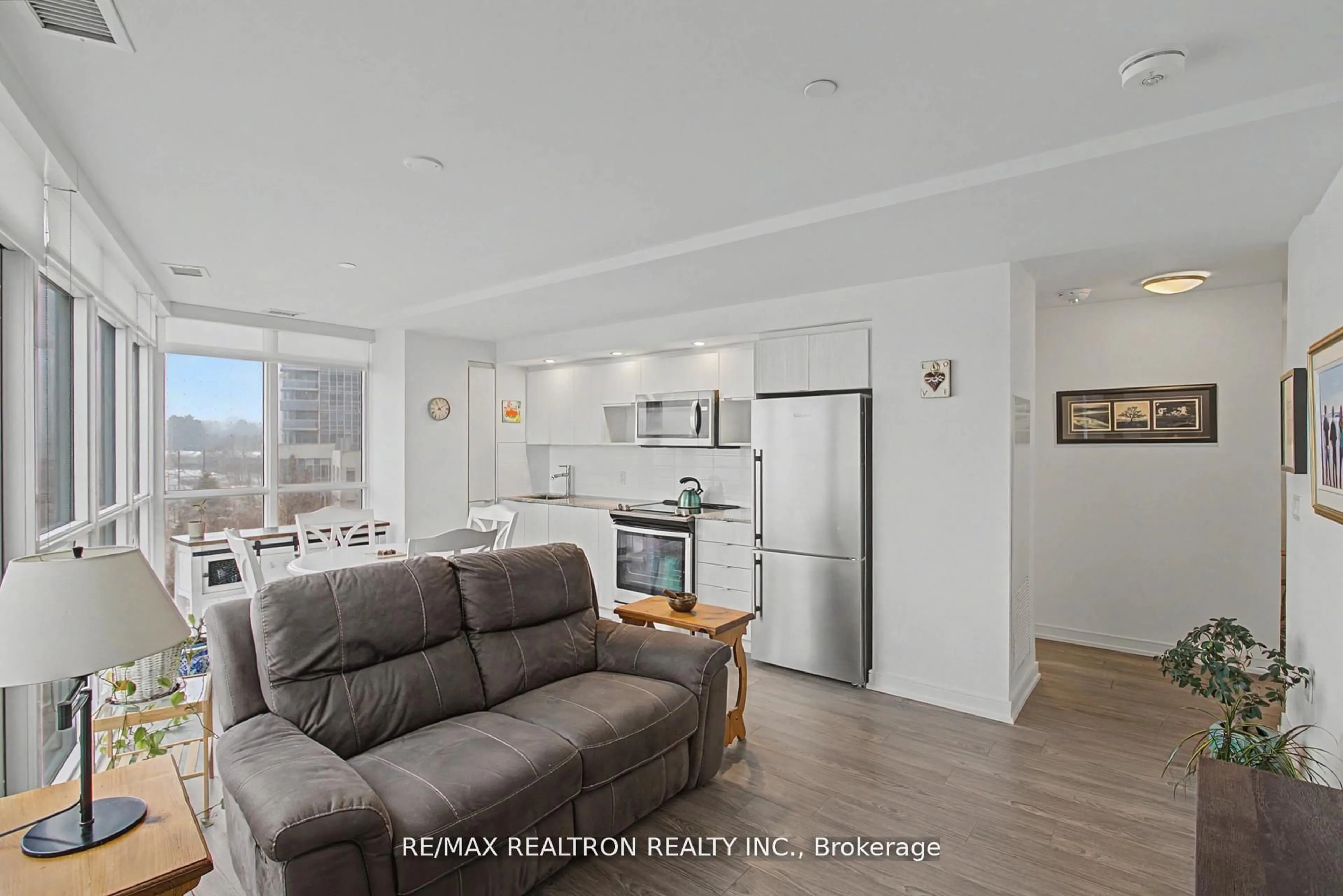 Living room with furniture, unknown for 225 Village Green Sq #308, Toronto Ontario M1S 0N4