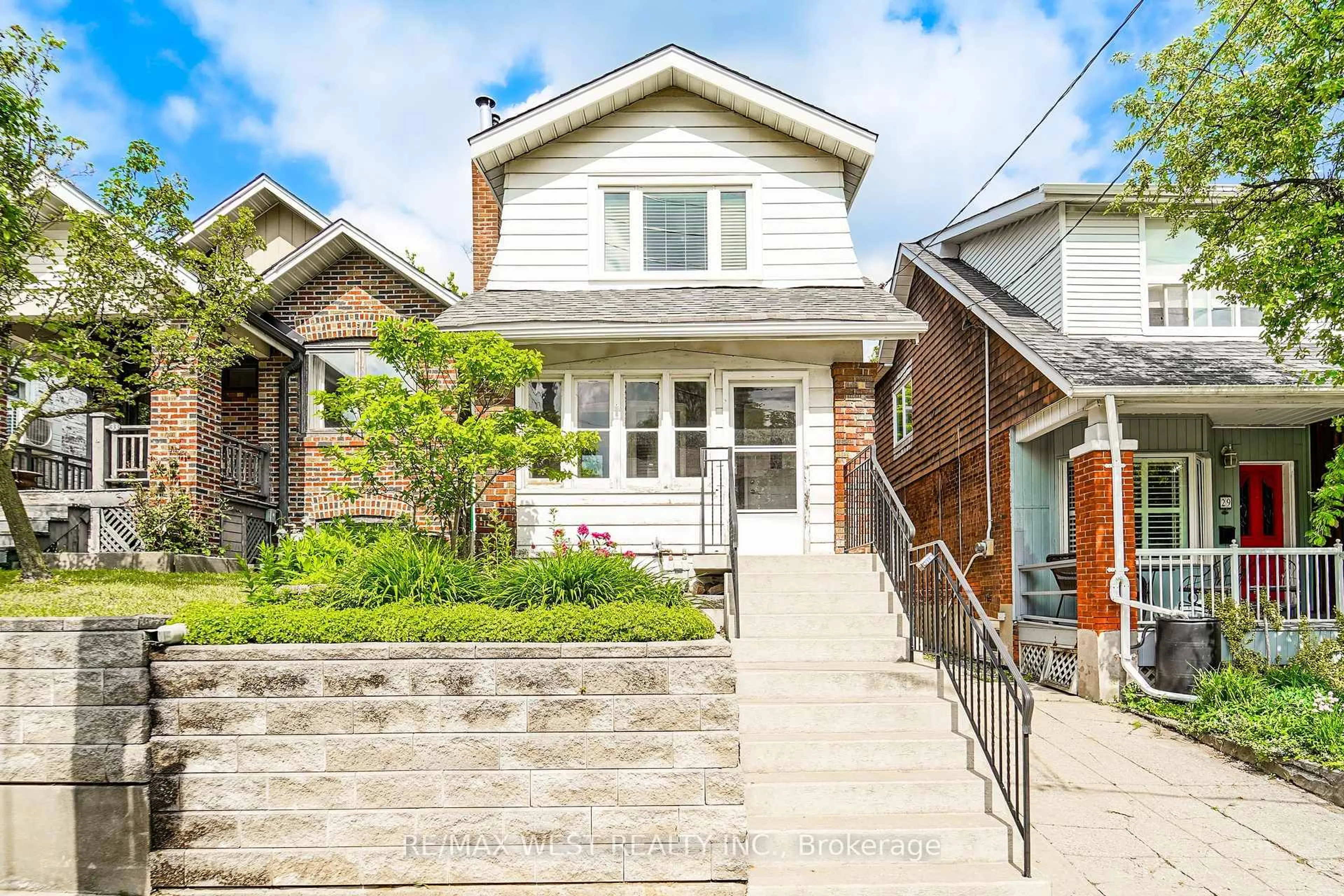 Home with brick exterior material, street for 31 Woodmount Ave, Toronto Ontario M4C 3X6