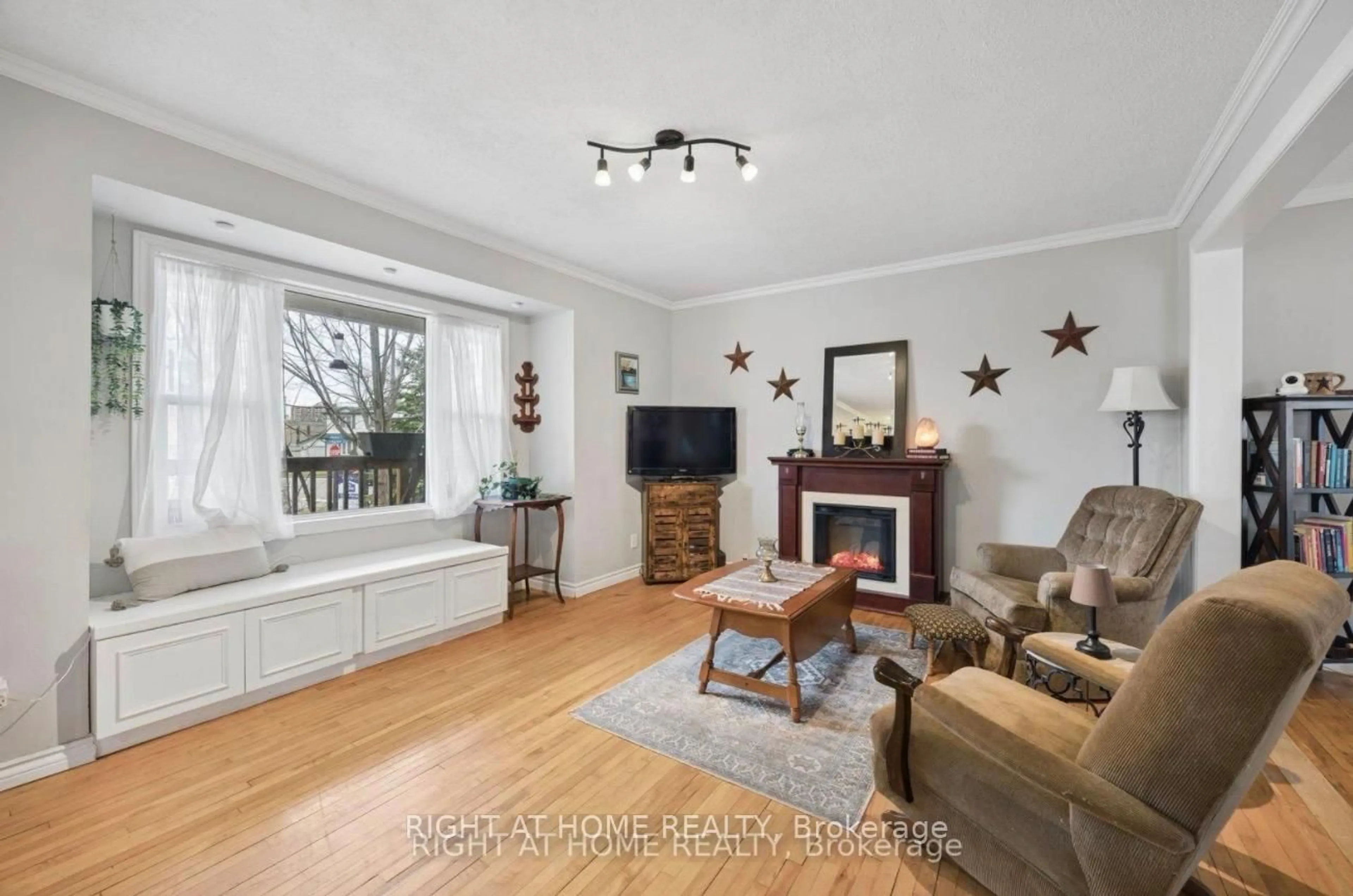 Living room with furniture, wood/laminate floor for 154 Admiral Rd, Ajax Ontario L1S 2P1
