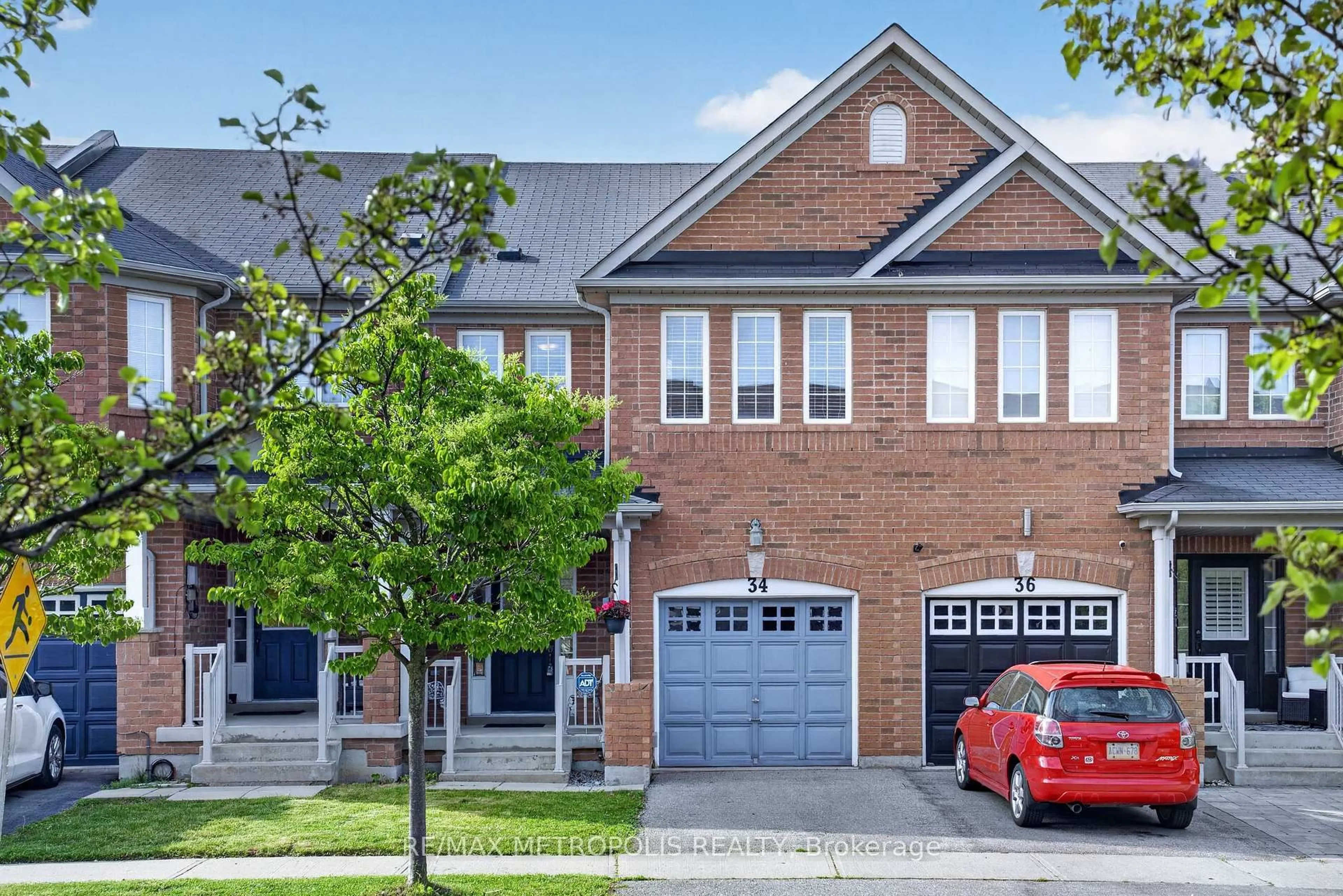 Home with brick exterior material, street for 34 Michaelman Rd, Ajax Ontario L1S 0C9