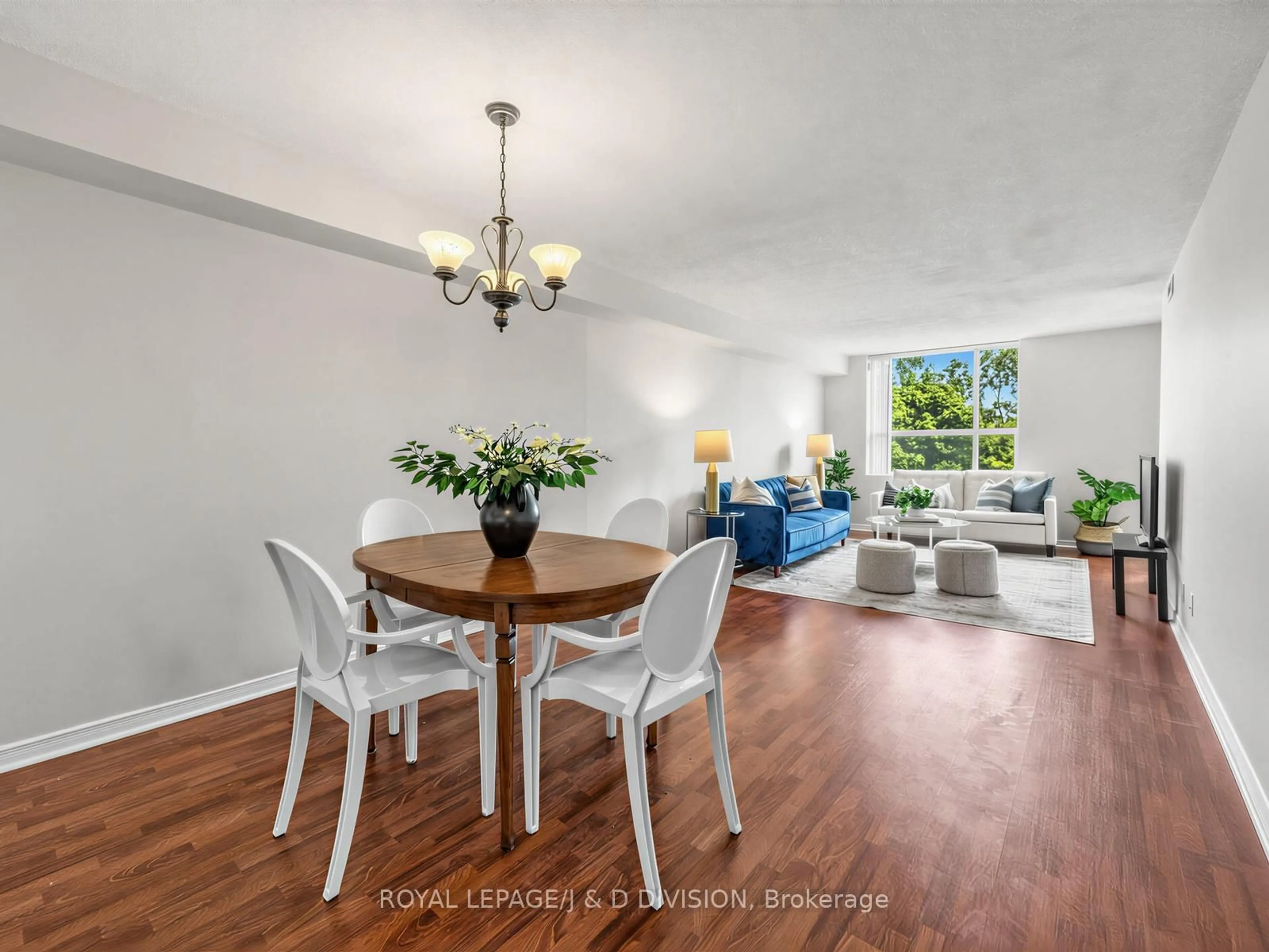 Living room with furniture, wood/laminate floor for 1665 Pickering Pkwy #211, Pickering Ontario L1V 6L4