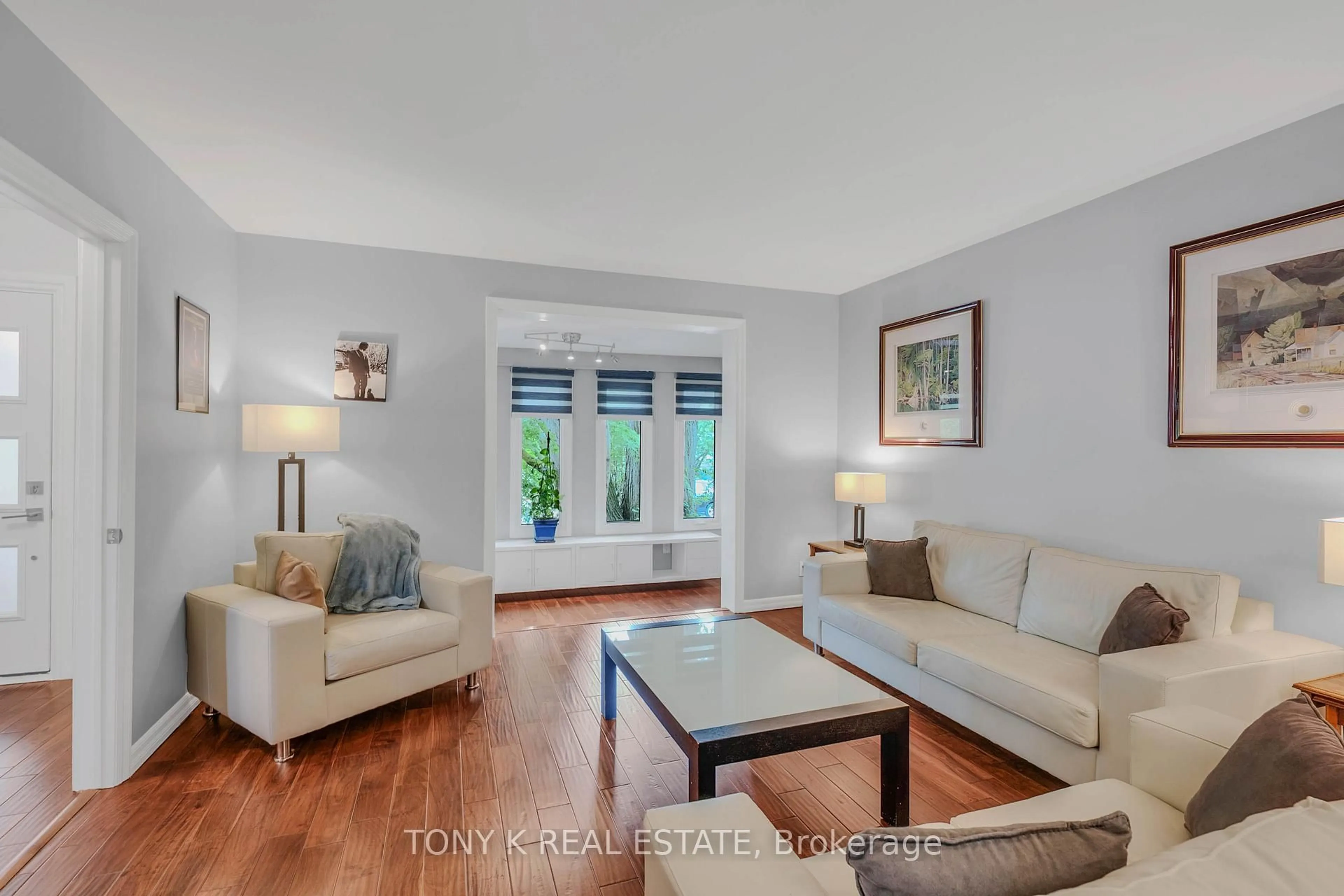 Living room with furniture, wood/laminate floor for 111 Eastwood Ave, Toronto Ontario M1N 3H4