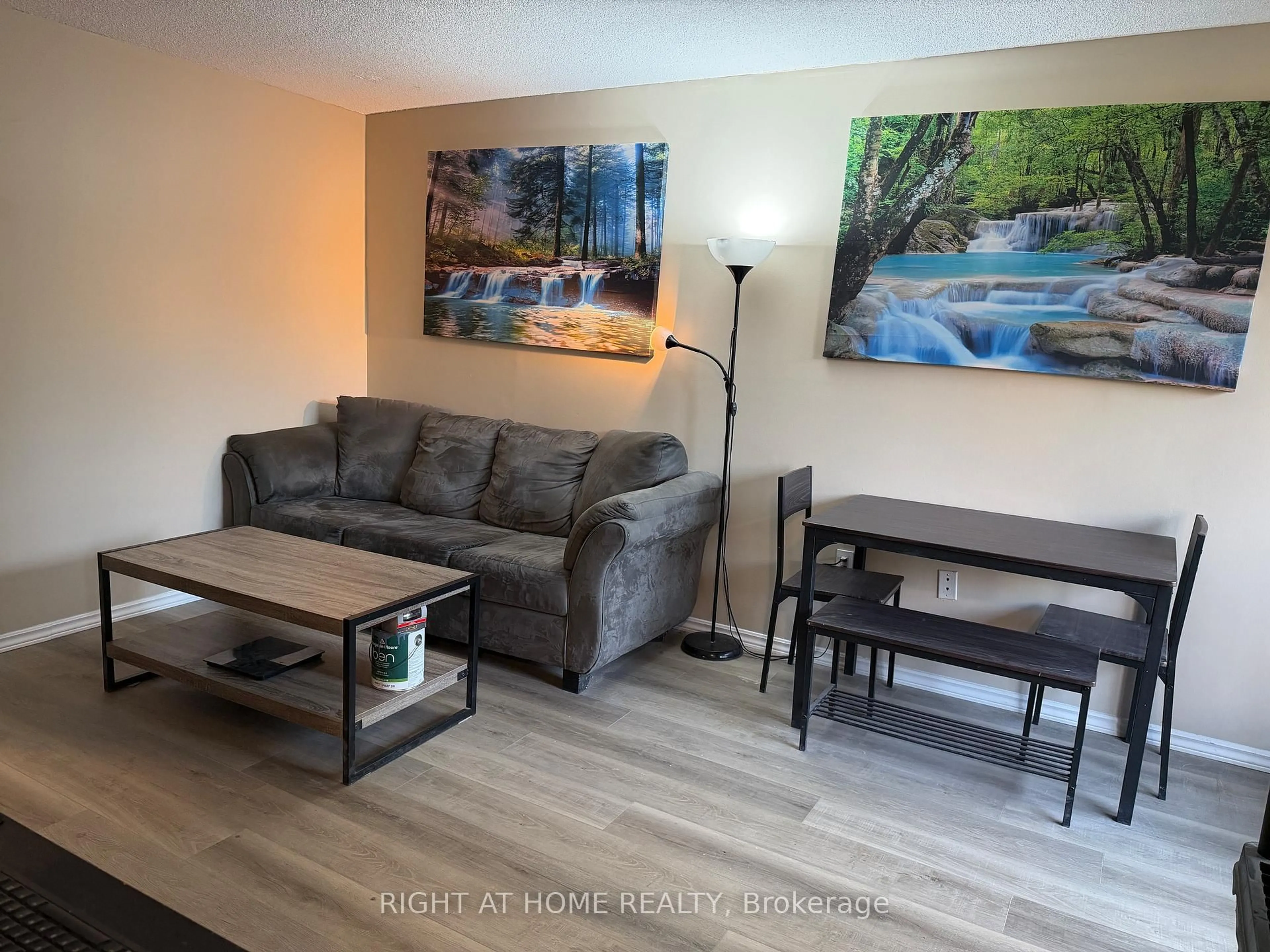 Living room with furniture, wood/laminate floor for 4064 Lawrence Ave #305, Toronto Ontario M1E 4V6