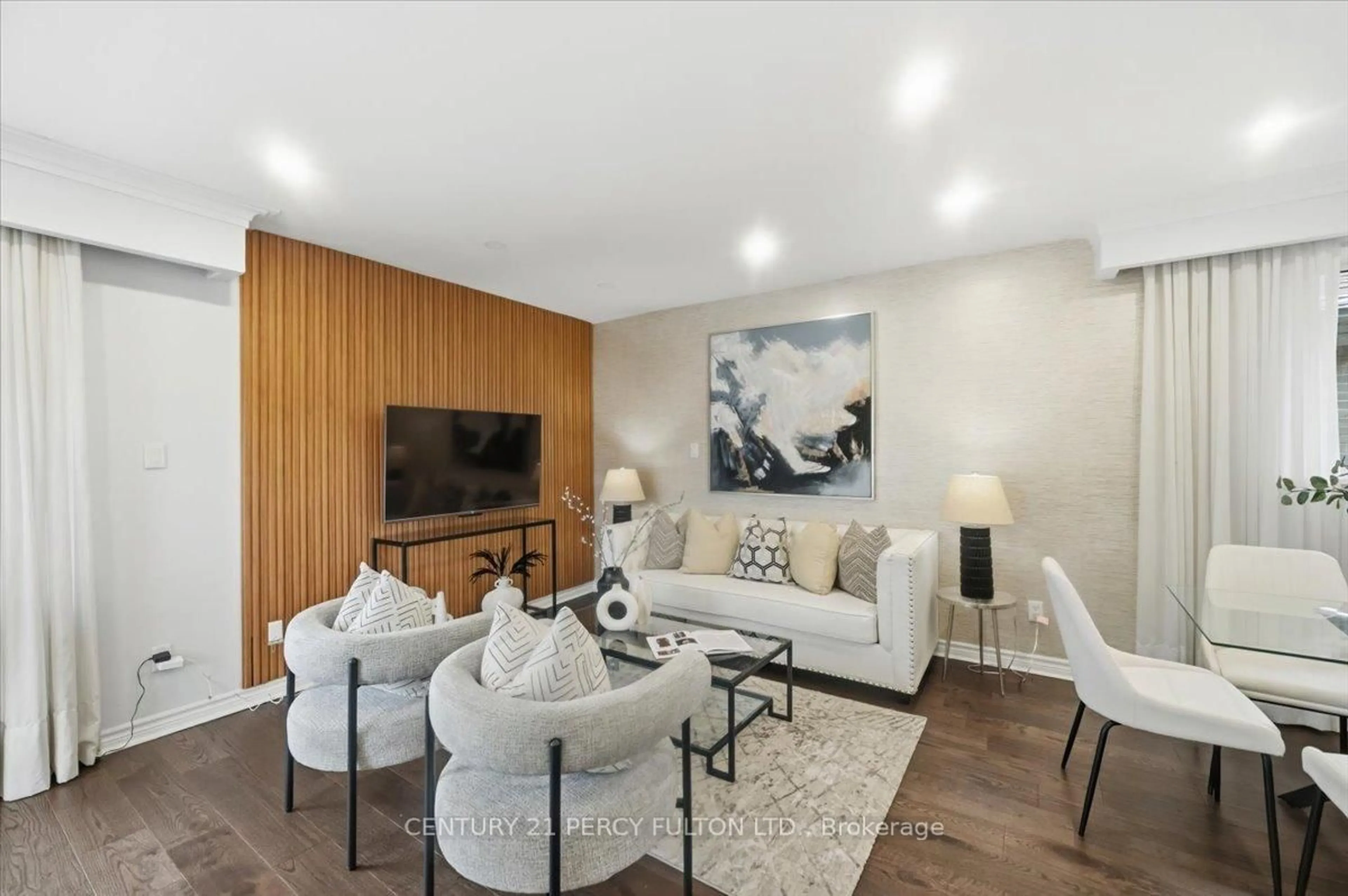 Living room with furniture, wood/laminate floor for 50 Mooregate Ave, Toronto Ontario M1K 3V7