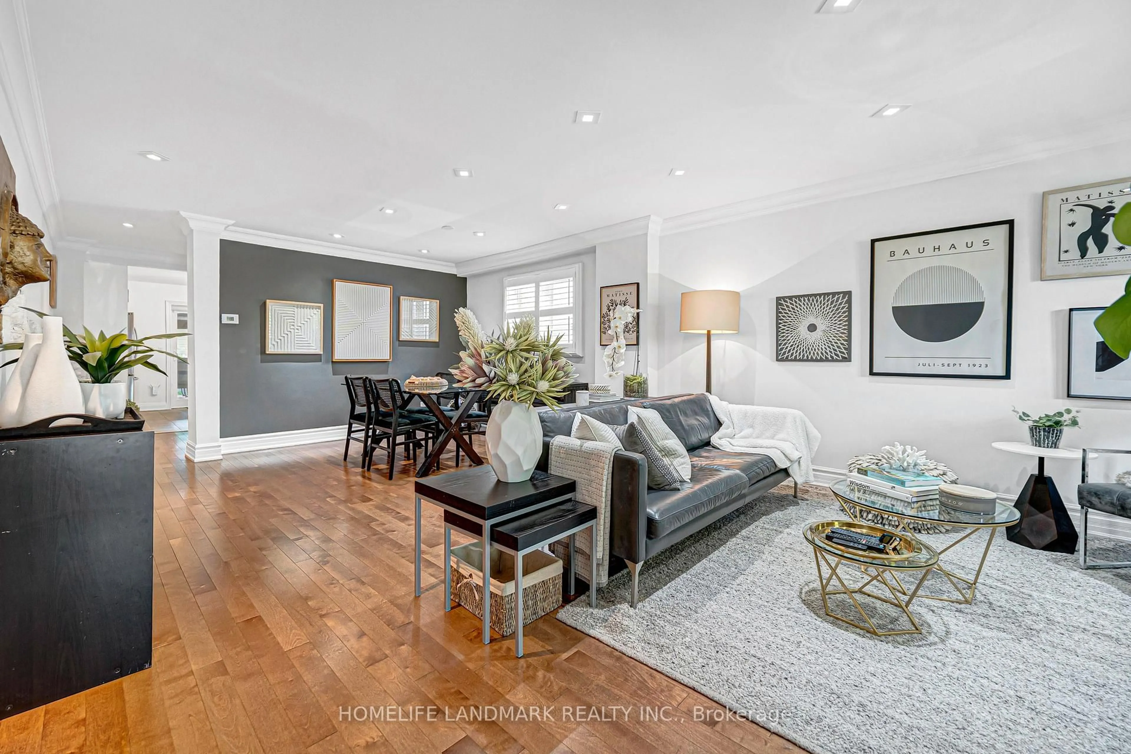 Living room with furniture, wood/laminate floor for 15 Denton Ave, Toronto Ontario M4C 1T7