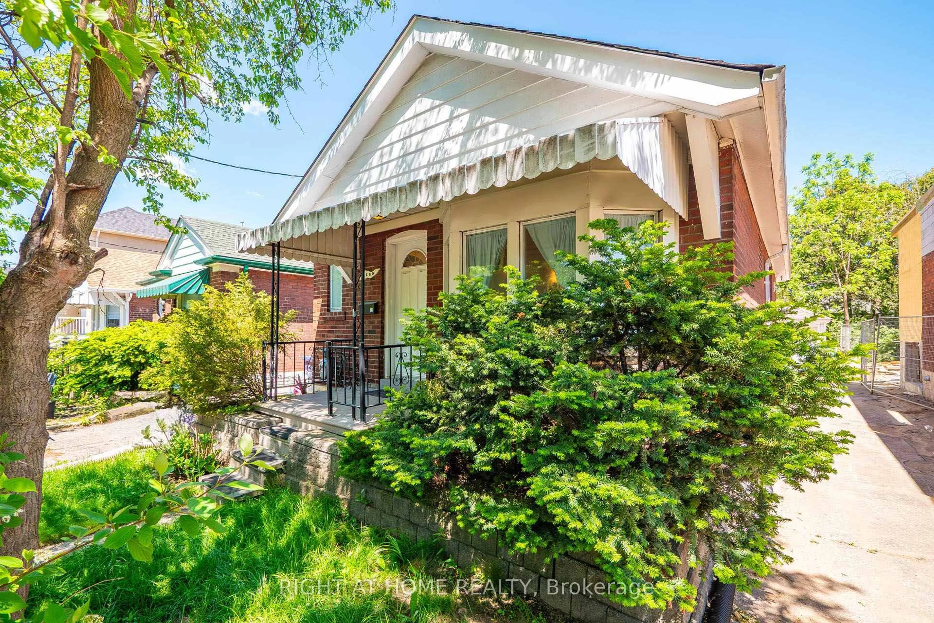 Home with brick exterior material, street for 1109 Greenwood Ave, Toronto Ontario M4J 4E5