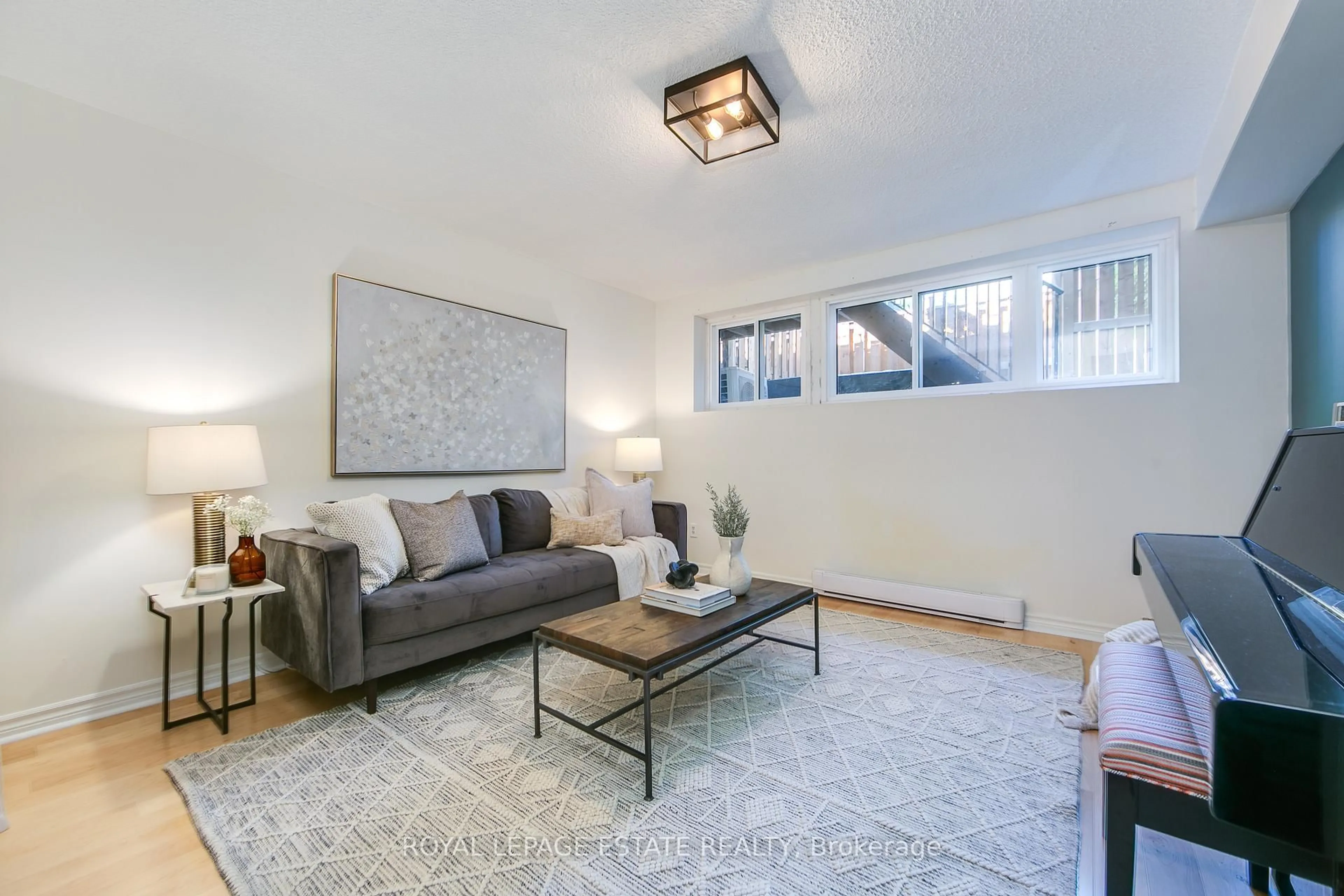 Living room with furniture, unknown for 1209 Queen St #72, Toronto Ontario M4M 3H4