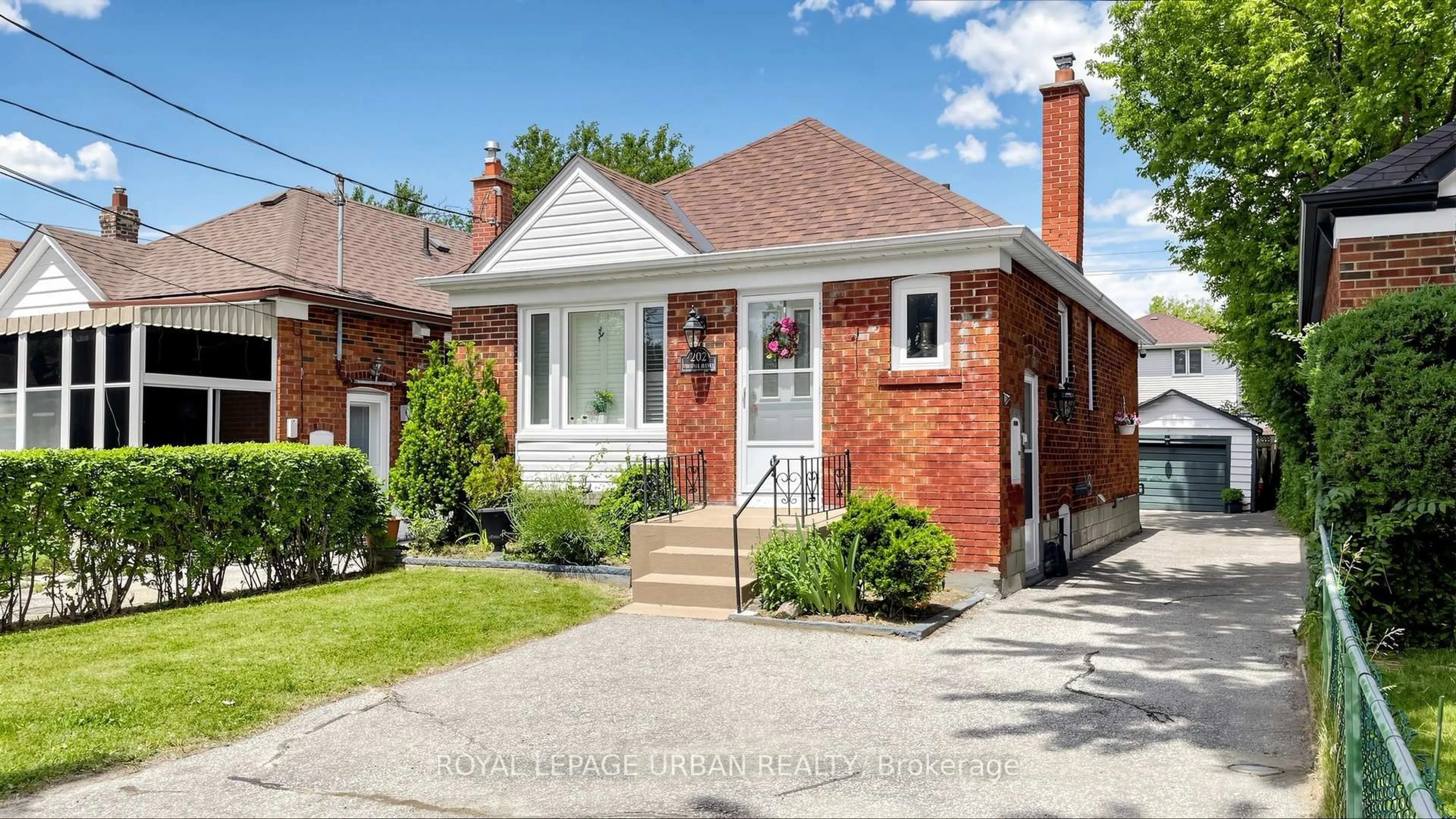 Home with brick exterior material, street for 202 Virginia Ave, Toronto Ontario M4C 2T7