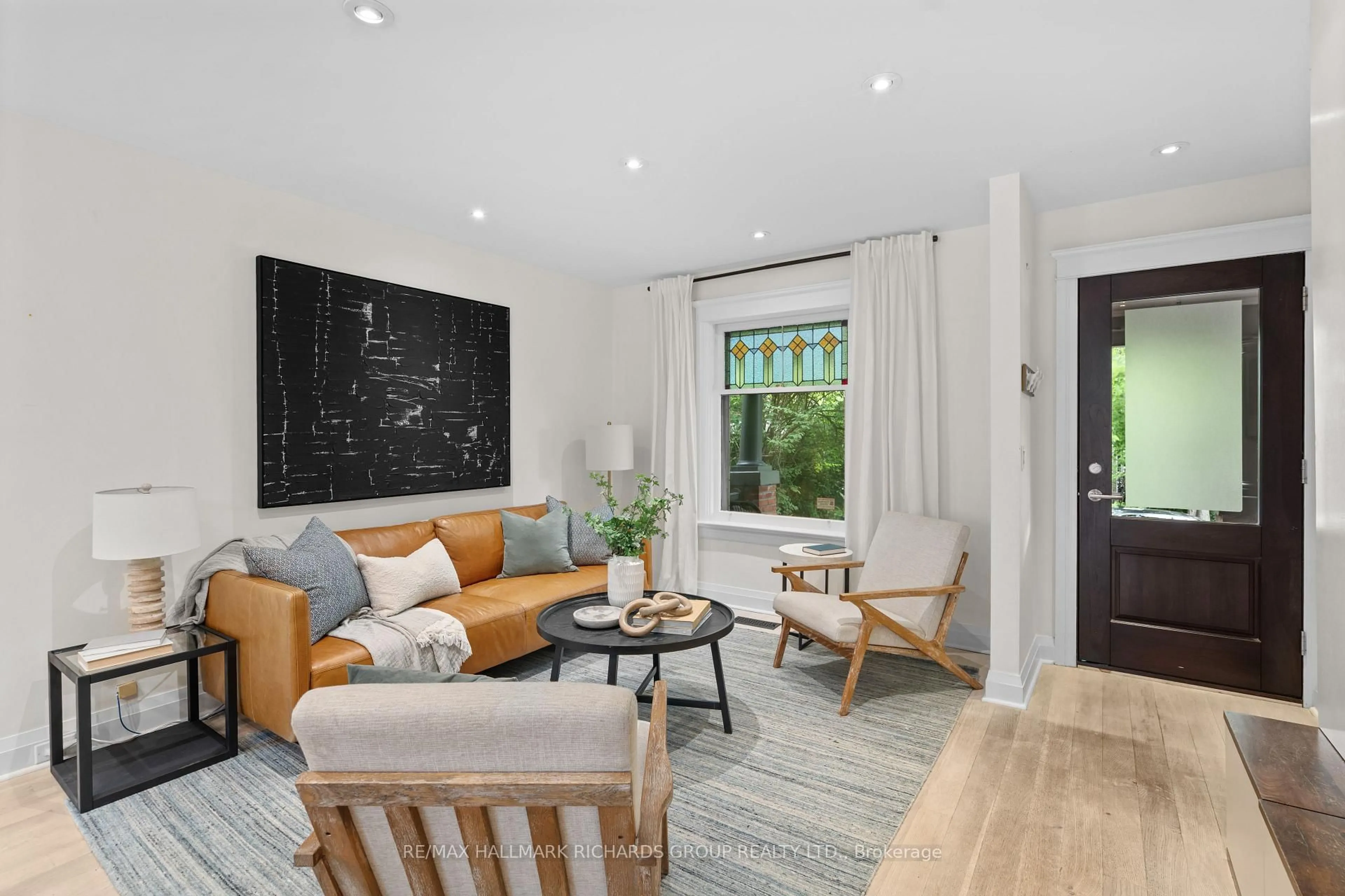 Living room with furniture, unknown for 178 Wineva Ave, Toronto Ontario M4E 2T4