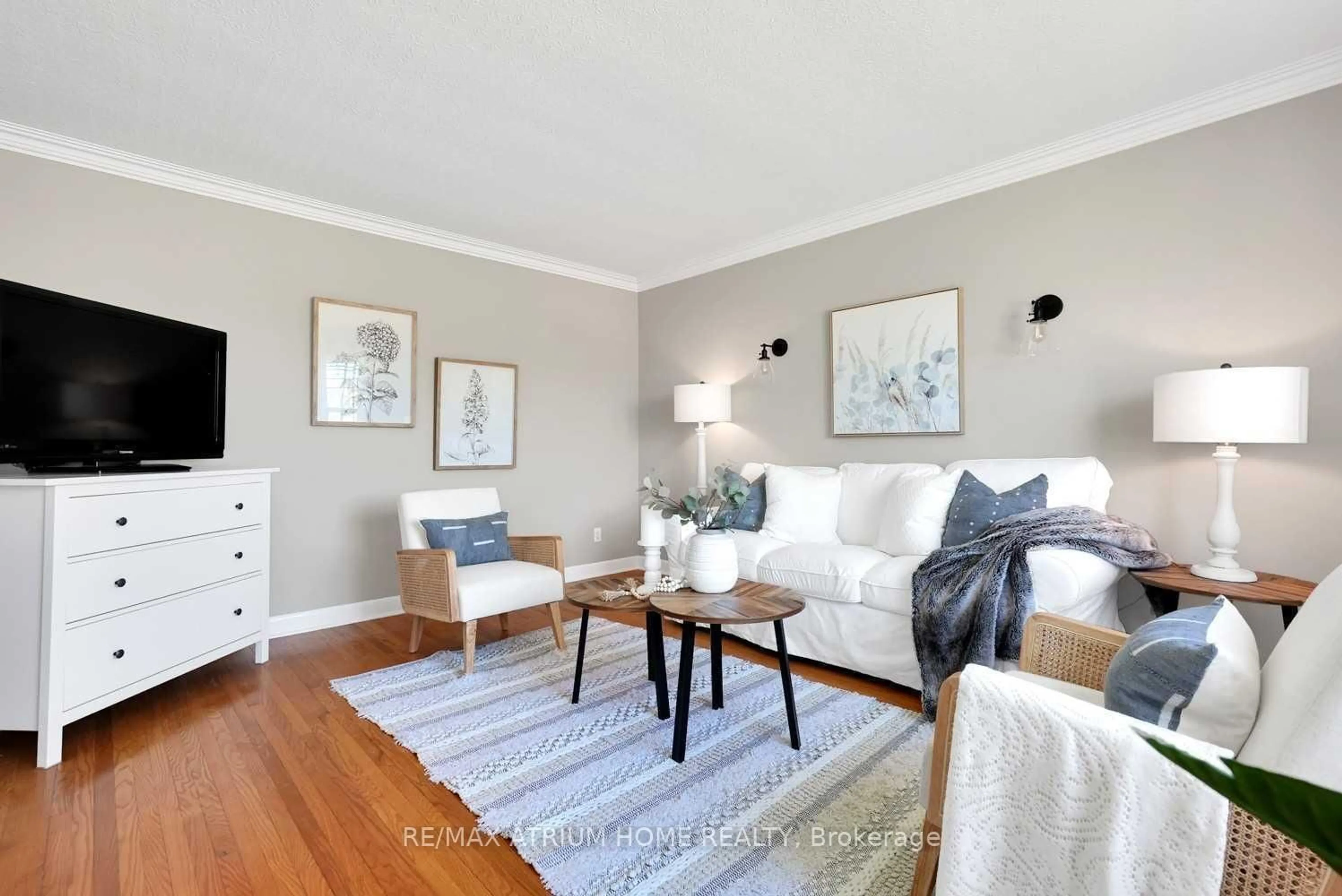 Living room with furniture, wood/laminate floor for 213 Conant St, Oshawa Ontario L1H 3S3