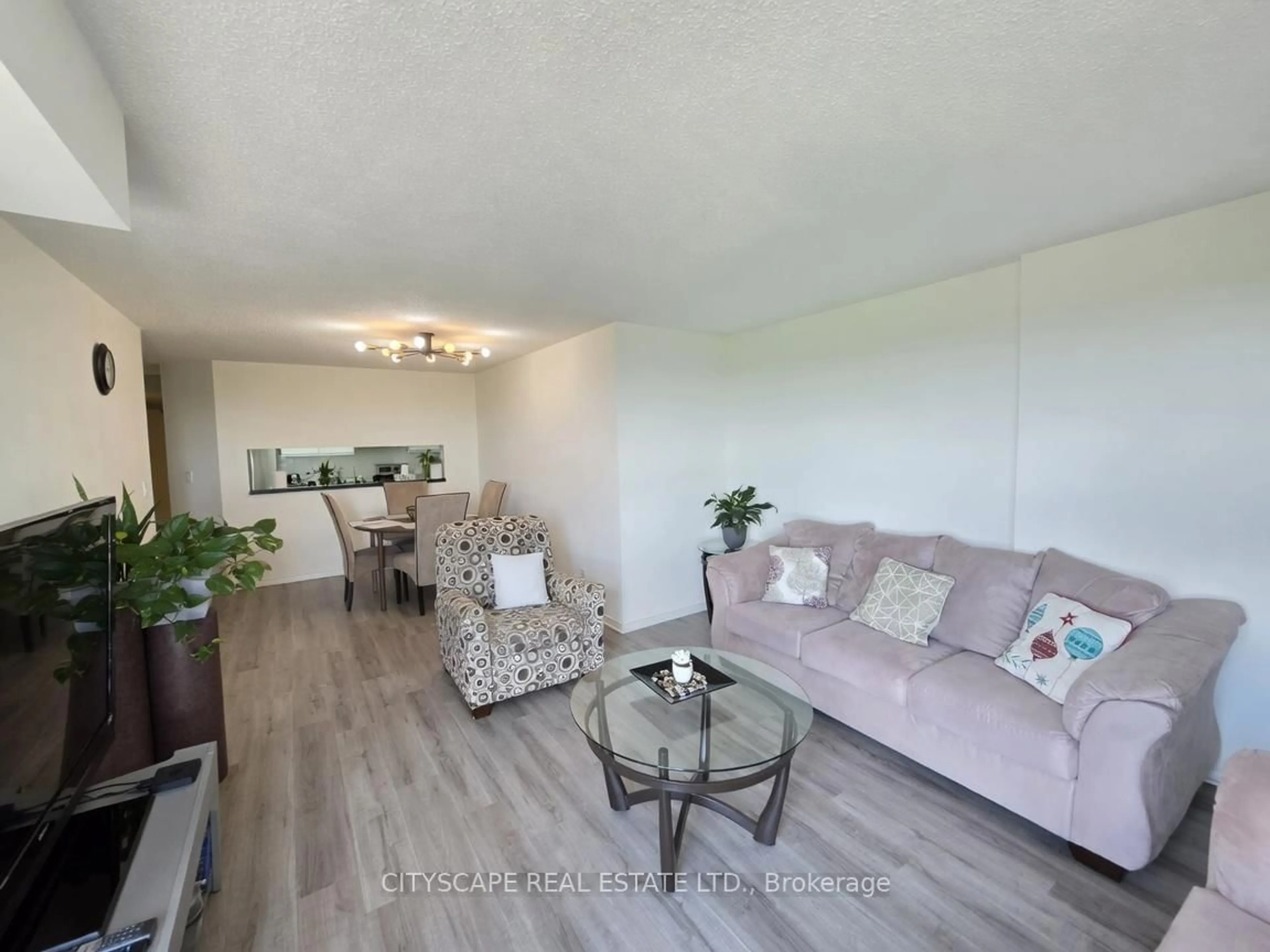 Living room with furniture, wood/laminate floor for 90 Dale Ave #502, Toronto Ontario M1J 3N4