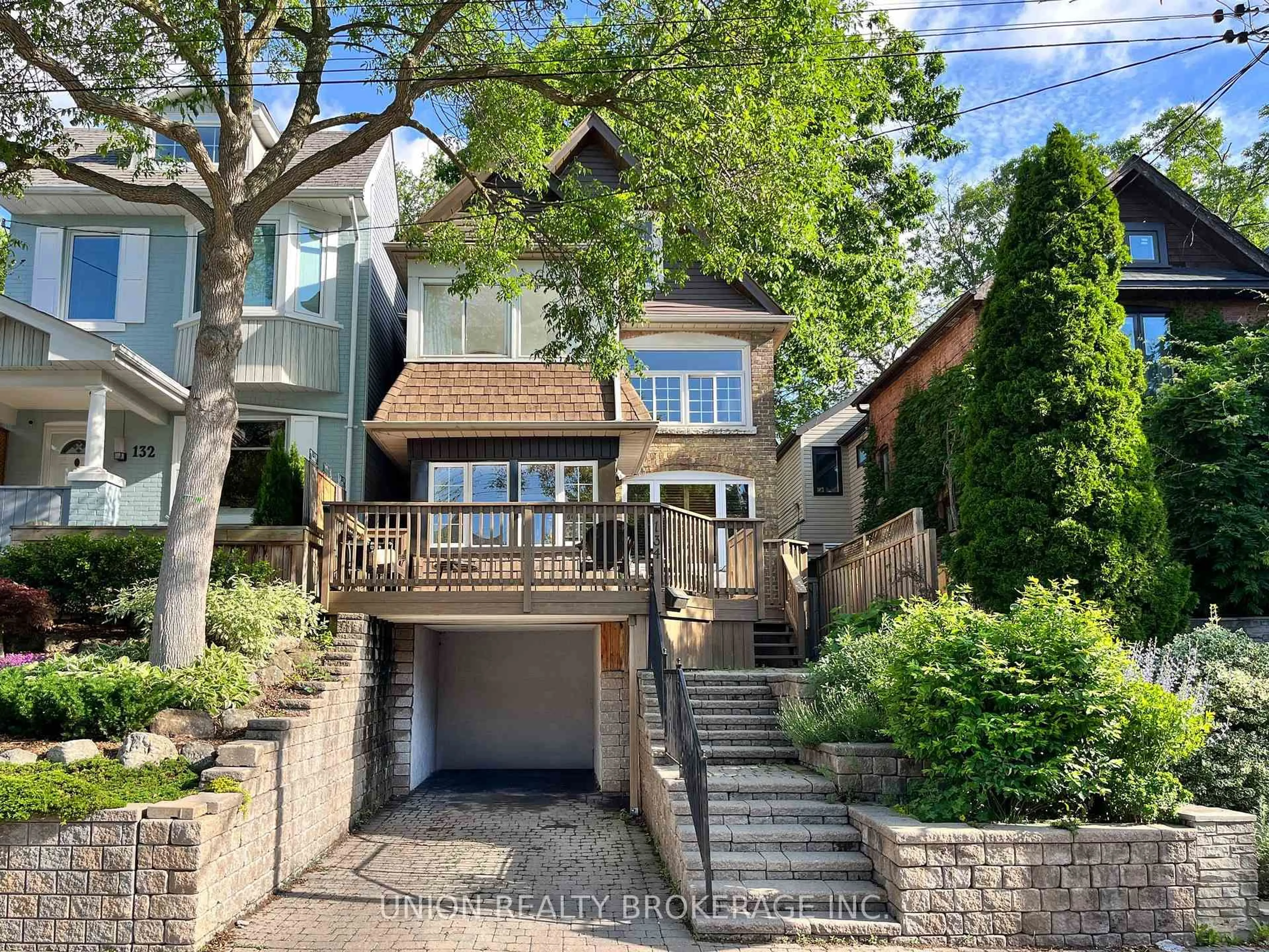 Home with brick exterior material, street for 134 Duvernet Ave, Toronto Ontario M4E 1V4