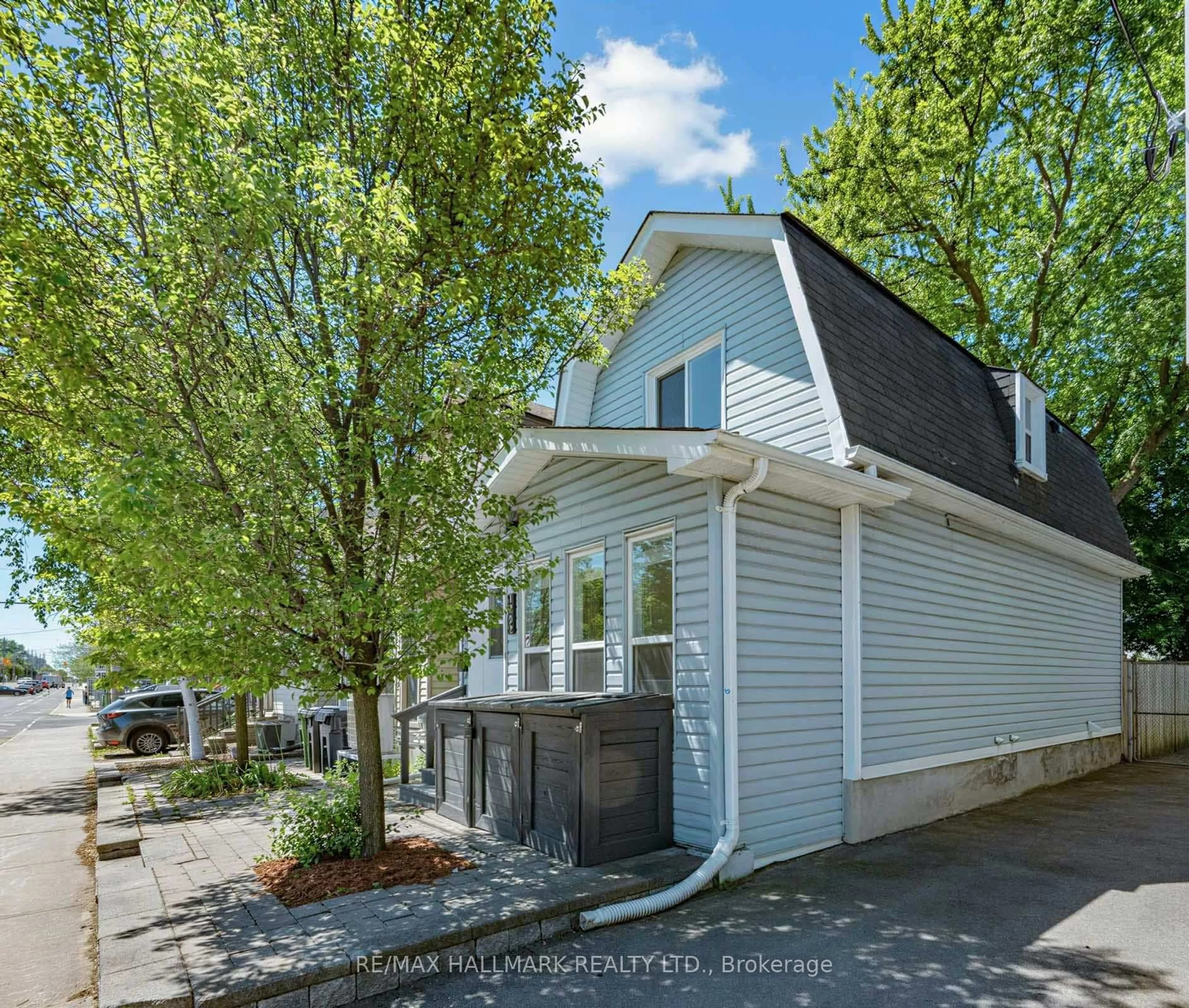 Home with vinyl exterior material, street for 1292 Woodbine Ave, Toronto Ontario M4C 4E7