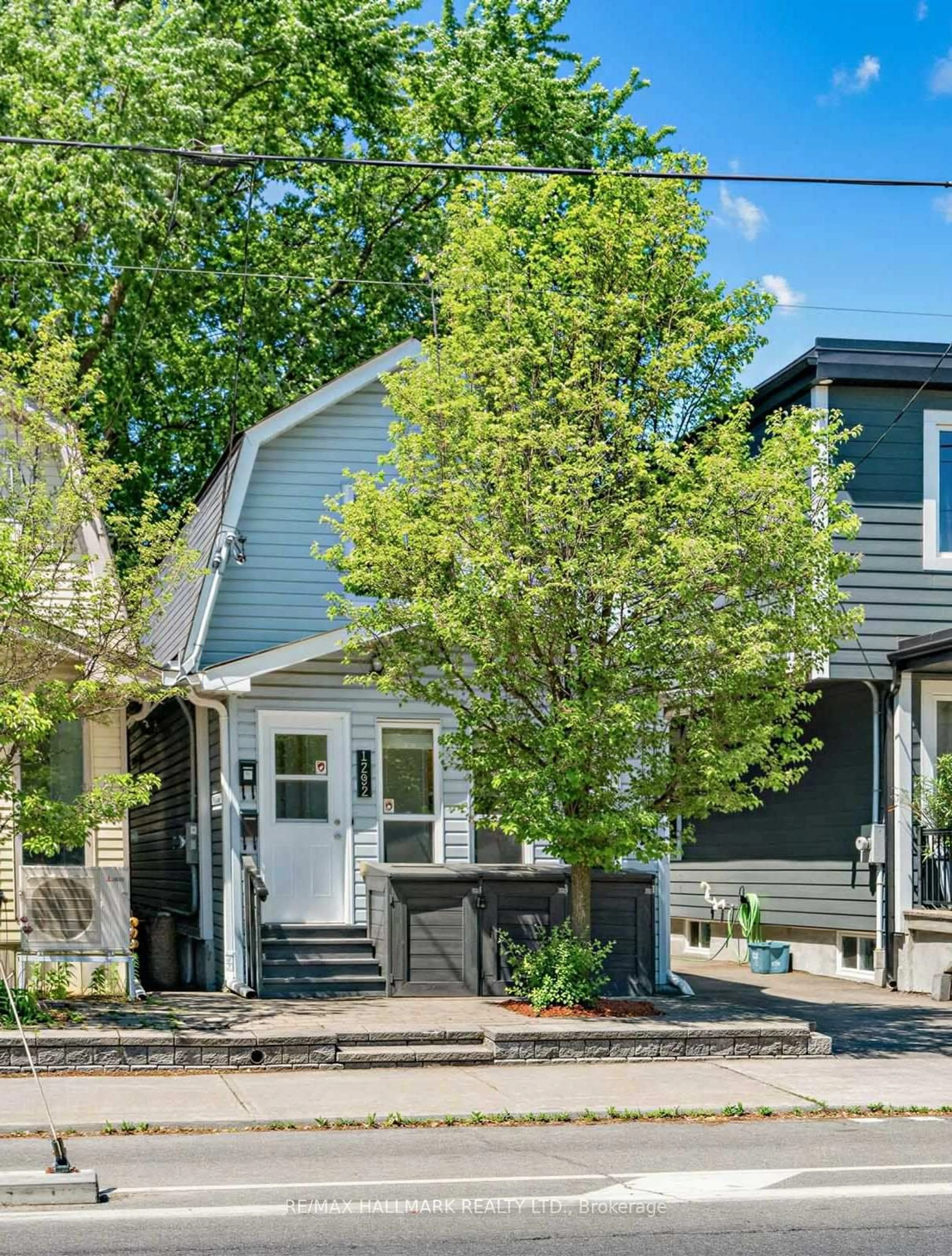 Home with vinyl exterior material, street for 1292 Woodbine Ave, Toronto Ontario M4C 4E7