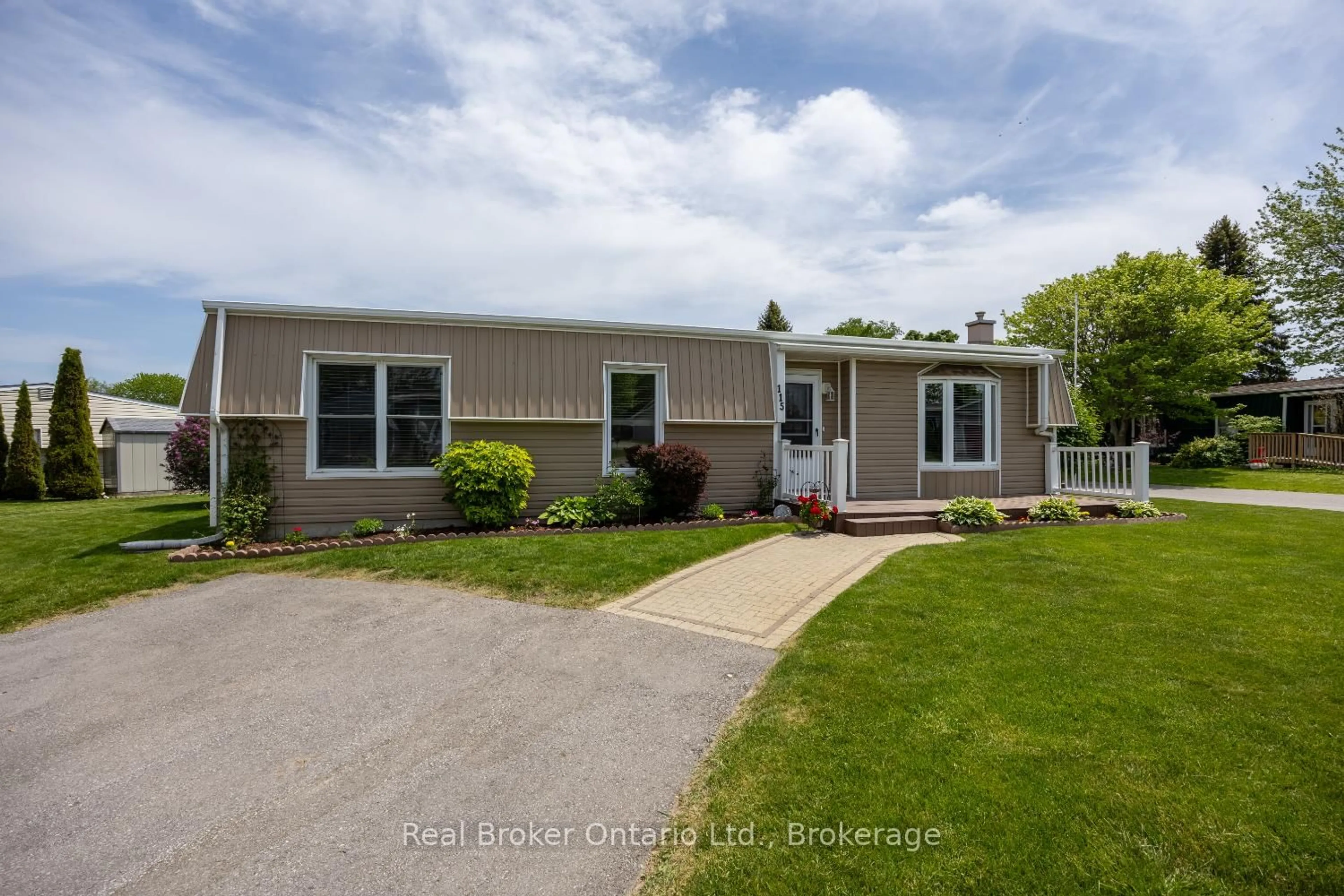 Home with vinyl exterior material, street for 115 Wilmot Tr, Clarington Ontario L1B 1A8