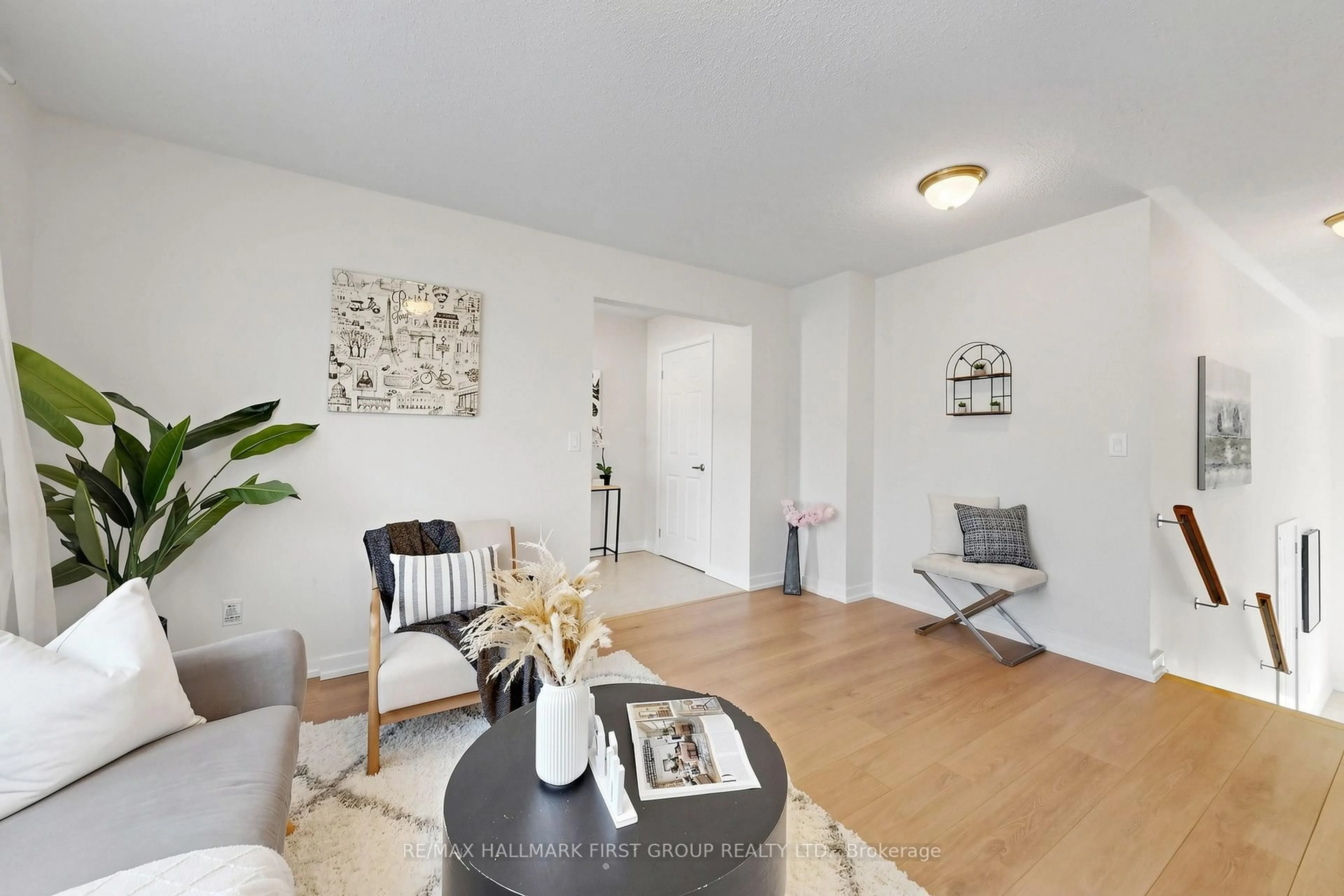 Living room with furniture, wood/laminate floor for 1299 Glenanna Rd #10, Pickering Ontario L1V 0C9