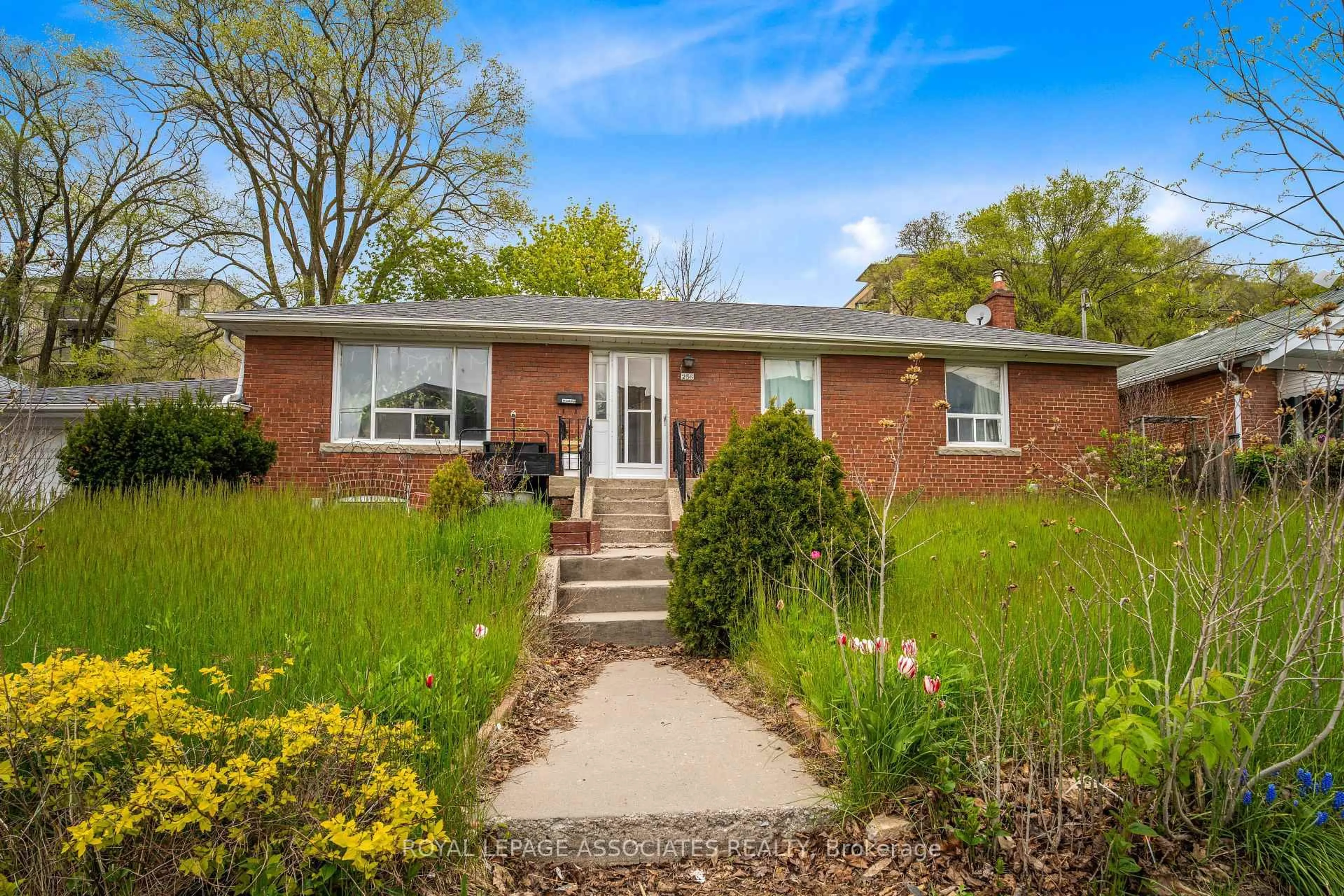Home with brick exterior material, street for 256 Ferris Rd, Toronto Ontario M4B 1H6