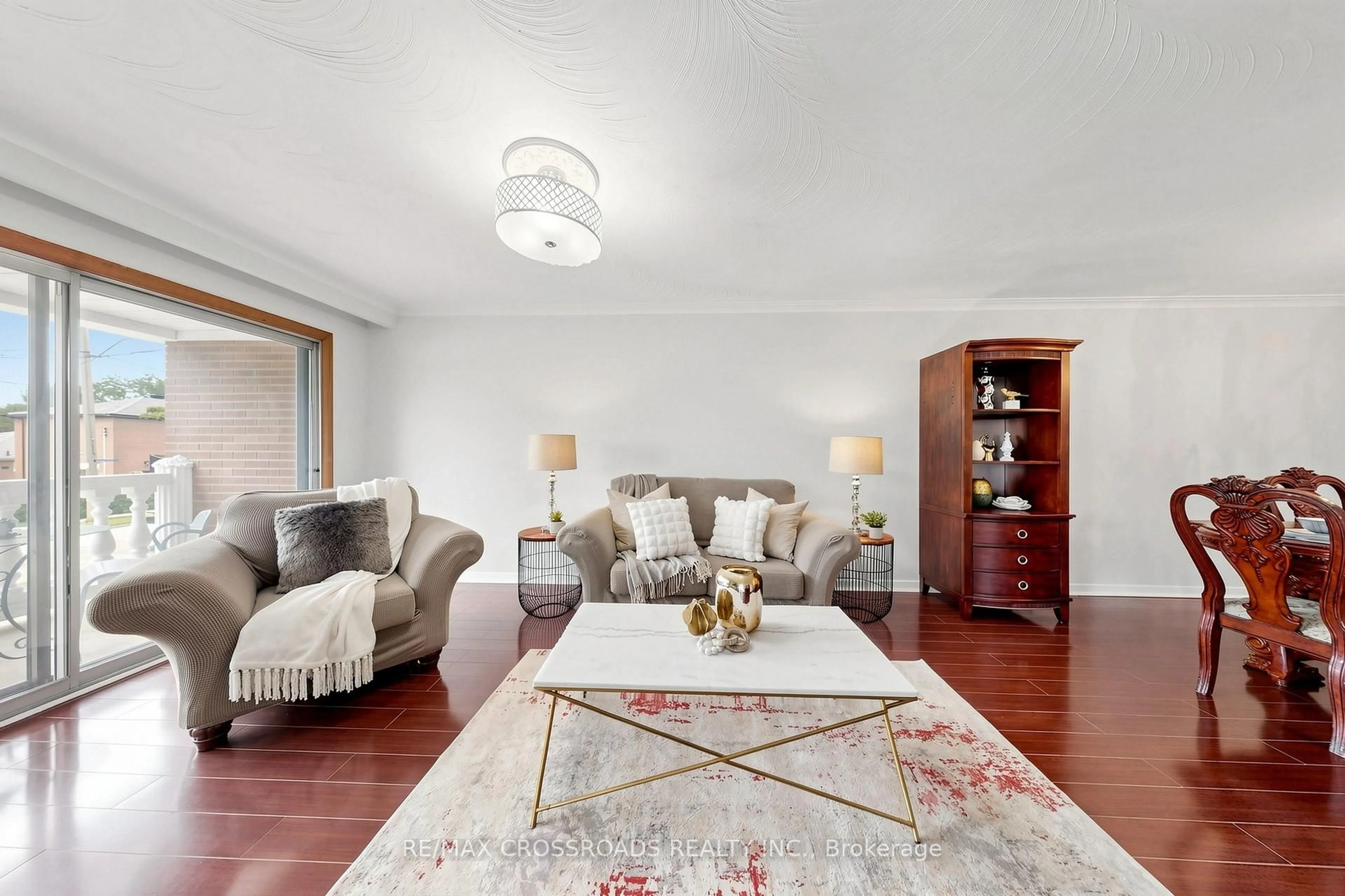 Living room with furniture, wood/laminate floor for 55 Bakerton Dr, Toronto Ontario M1J 2T3