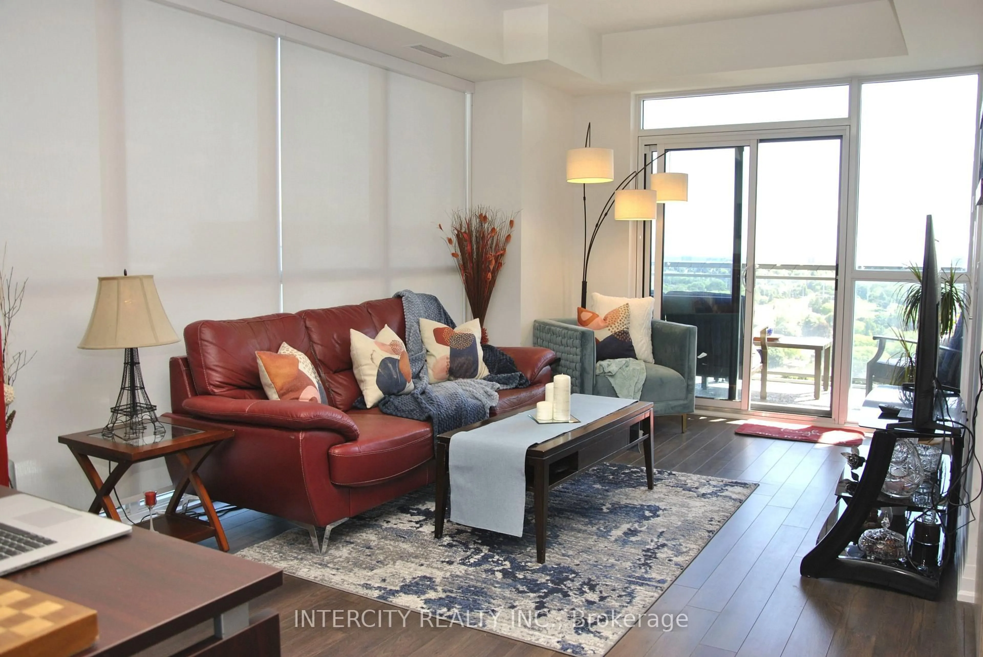 Living room with furniture, wood/laminate floor for 20 Meadowglen Pl #1901, Toronto Ontario M1G 0A9