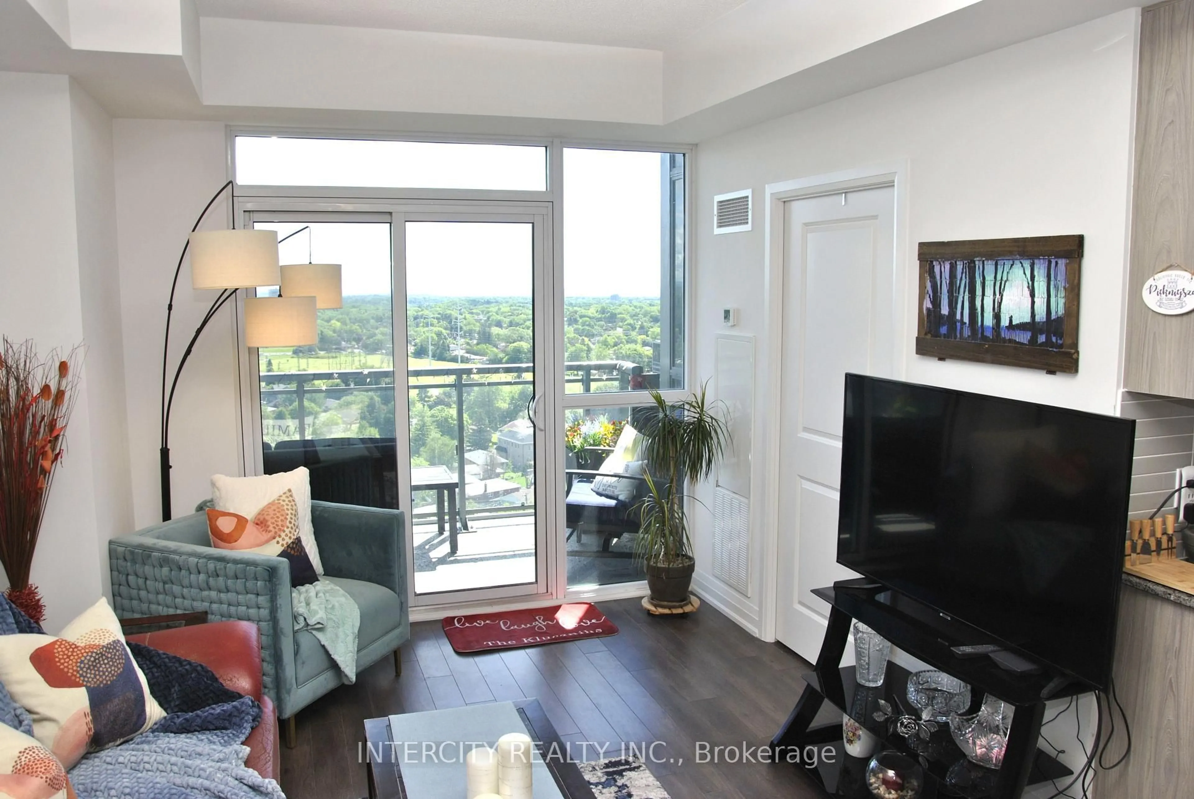 Living room with furniture, wood/laminate floor for 20 Meadowglen Pl #1901, Toronto Ontario M1G 0A9