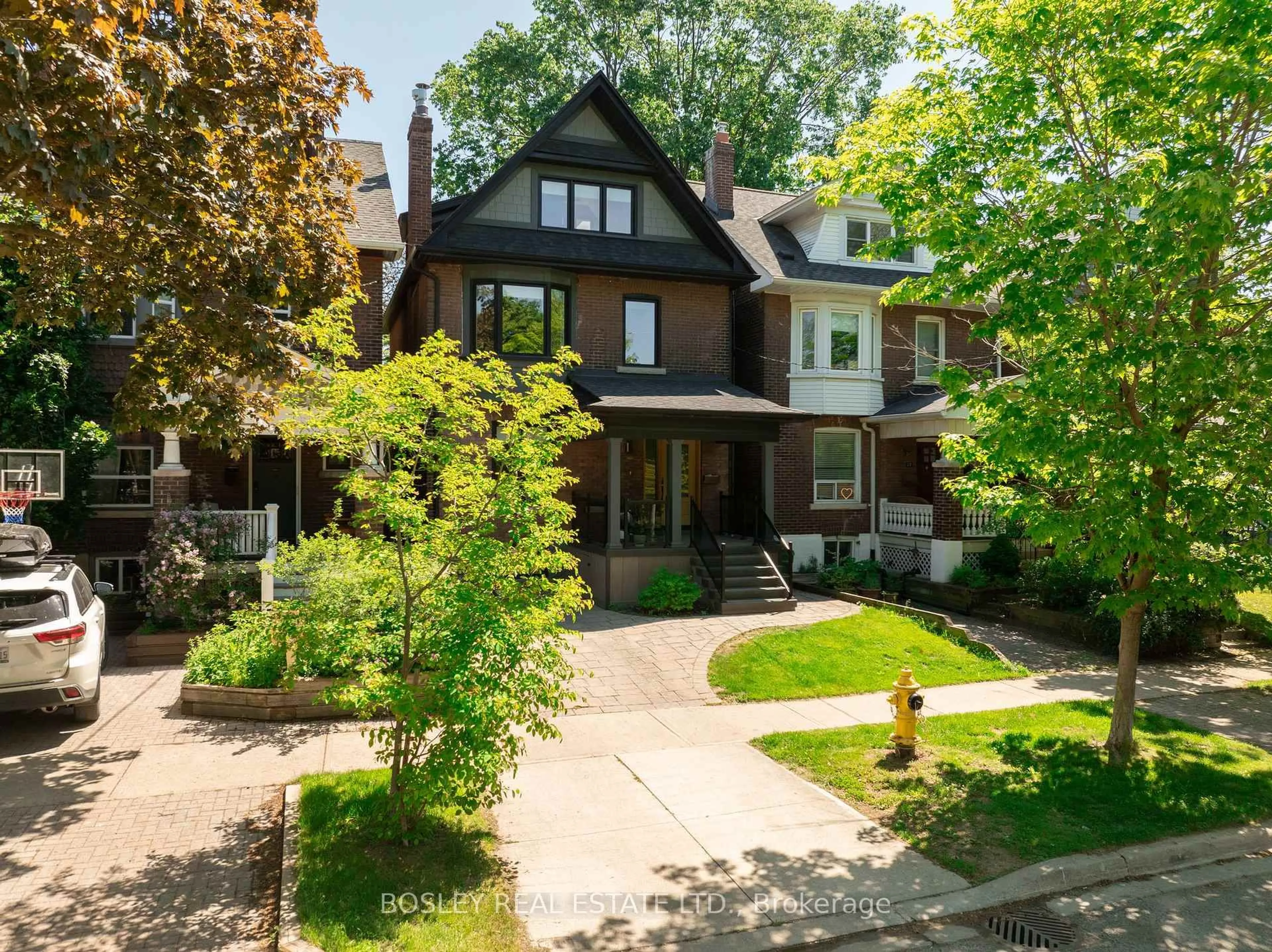 Home with brick exterior material, street for 19 Lark St, Toronto Ontario M4L 3M5
