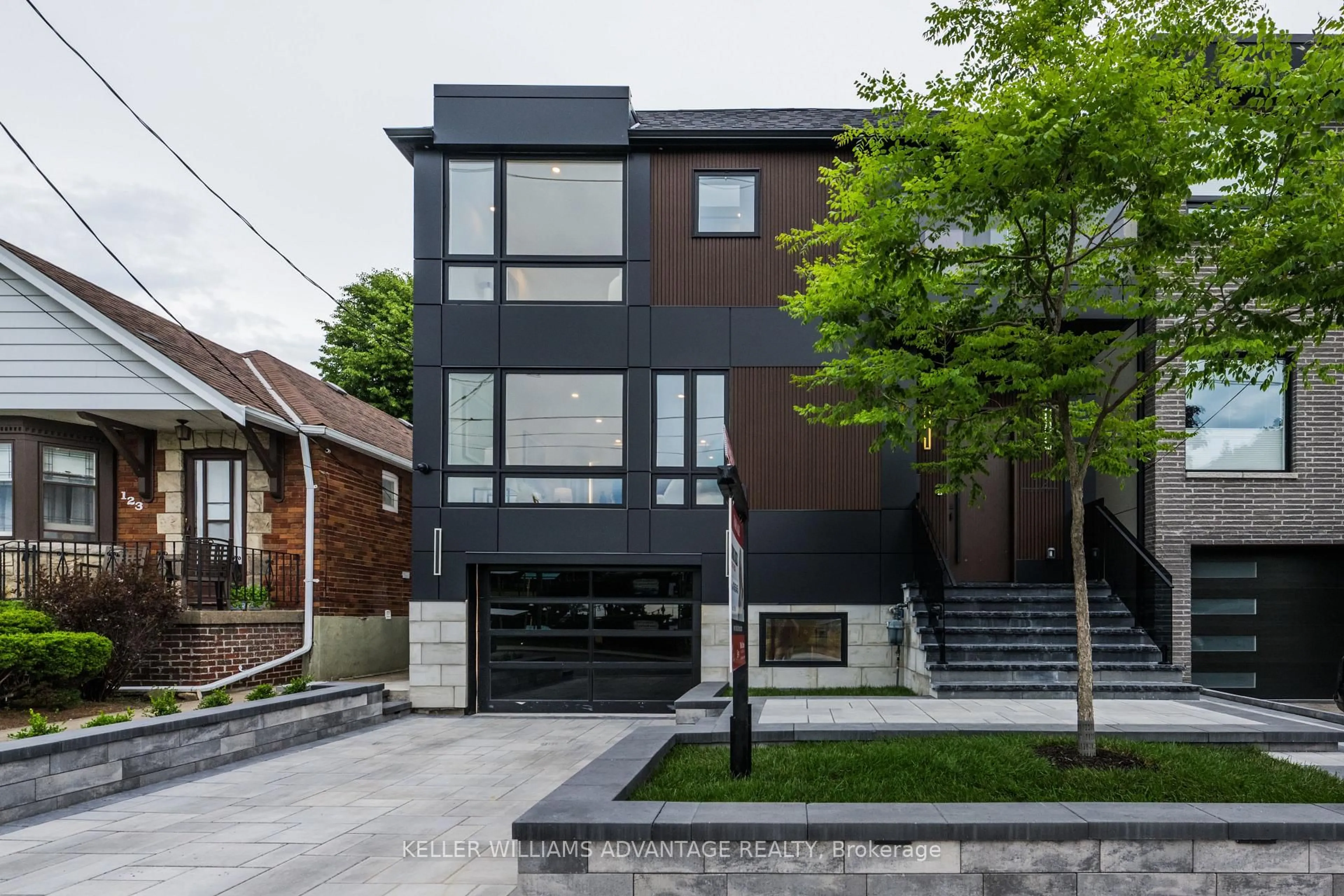 Home with brick exterior material, street for 121 Durant Ave, Toronto Ontario M4J 4W3