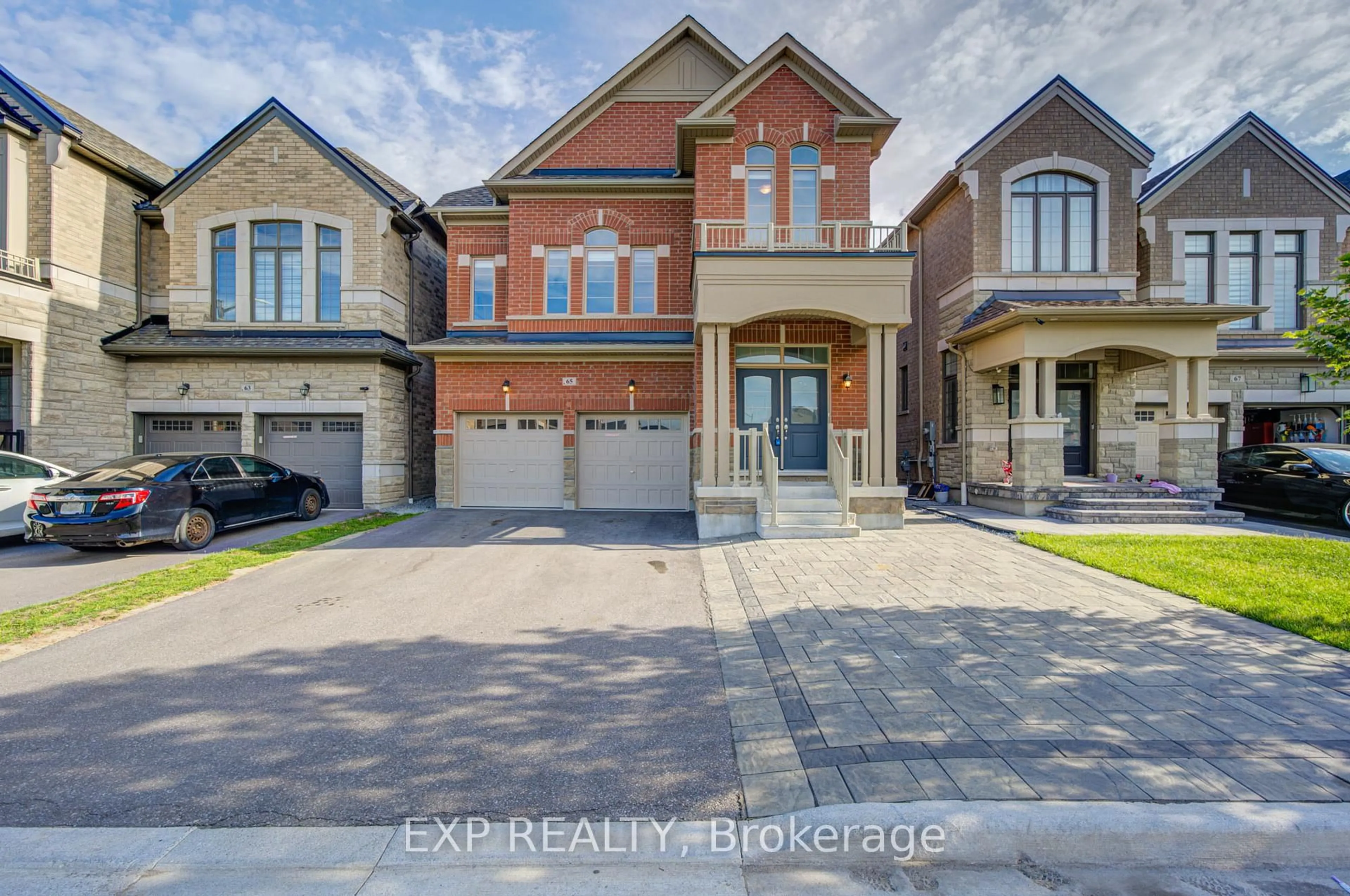 Home with brick exterior material, street for 65 Marcel Brunelle Dr, Whitby Ontario L1P 0G9
