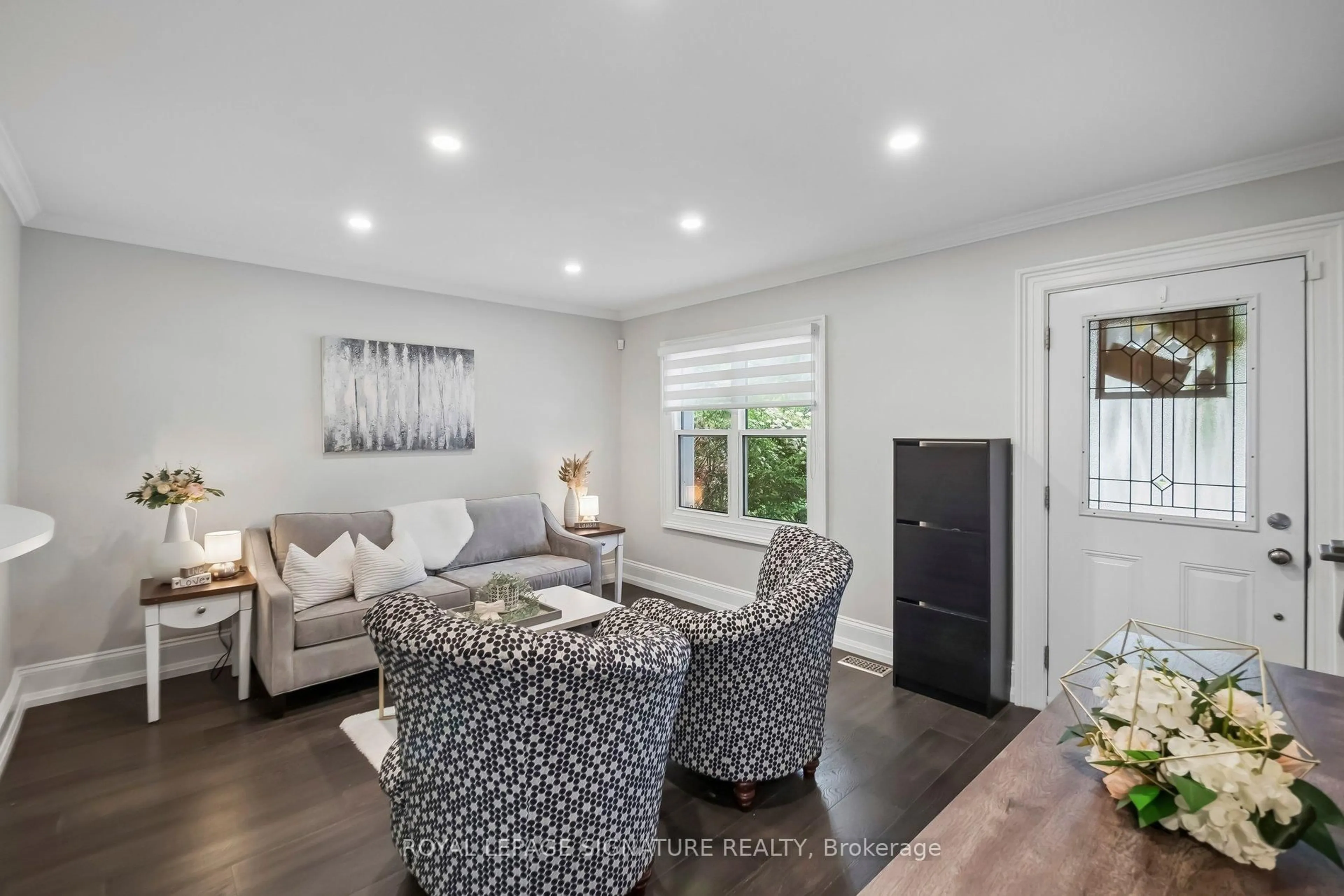 Living room with furniture, wood/laminate floor for 23 Arlington Ave, Oshawa Ontario L1G 2N3