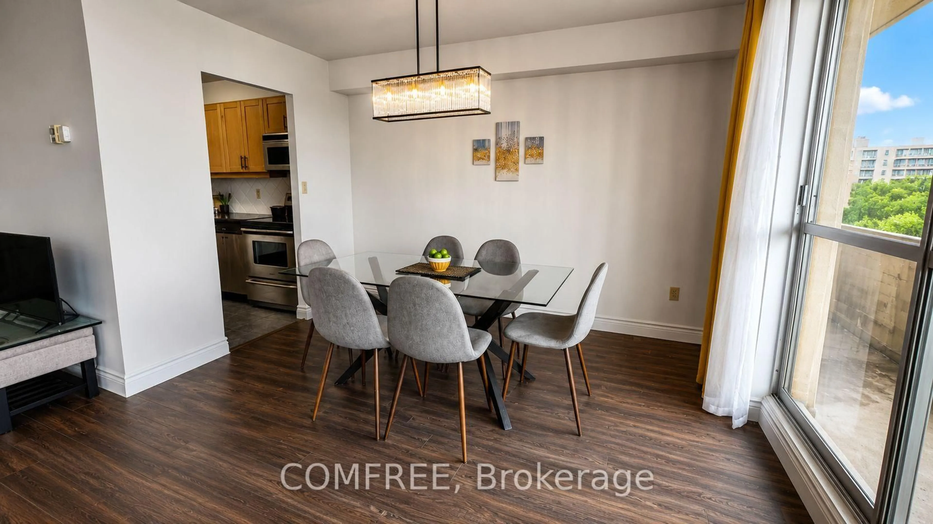 Dining room, wood/laminate floor for 1 Massey Sq #412, Toronto Ontario M4C 5L4