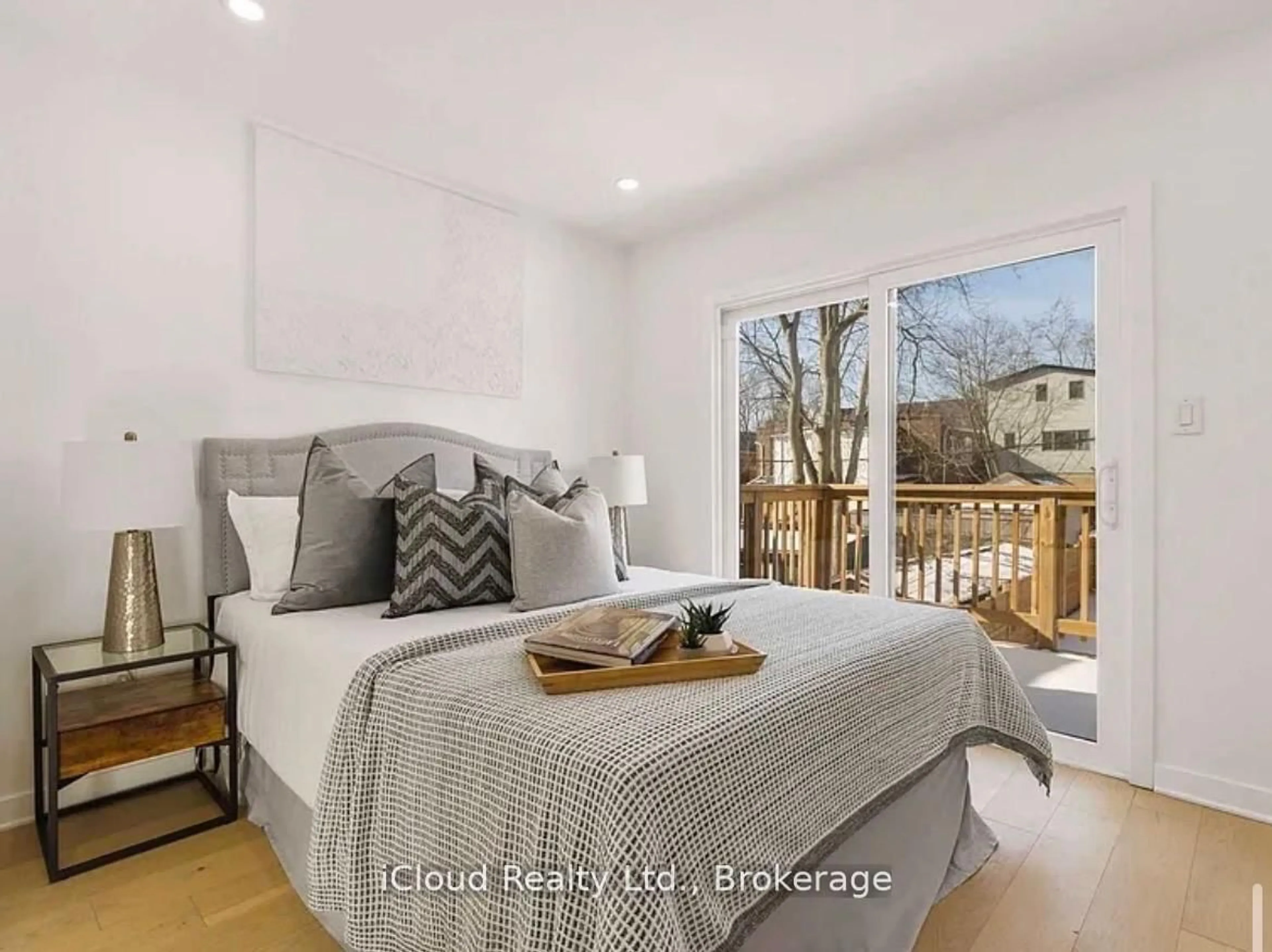 Bedroom with bed, wood/laminate floor for 386 Coxwell Ave, Toronto Ontario M4L 3B7