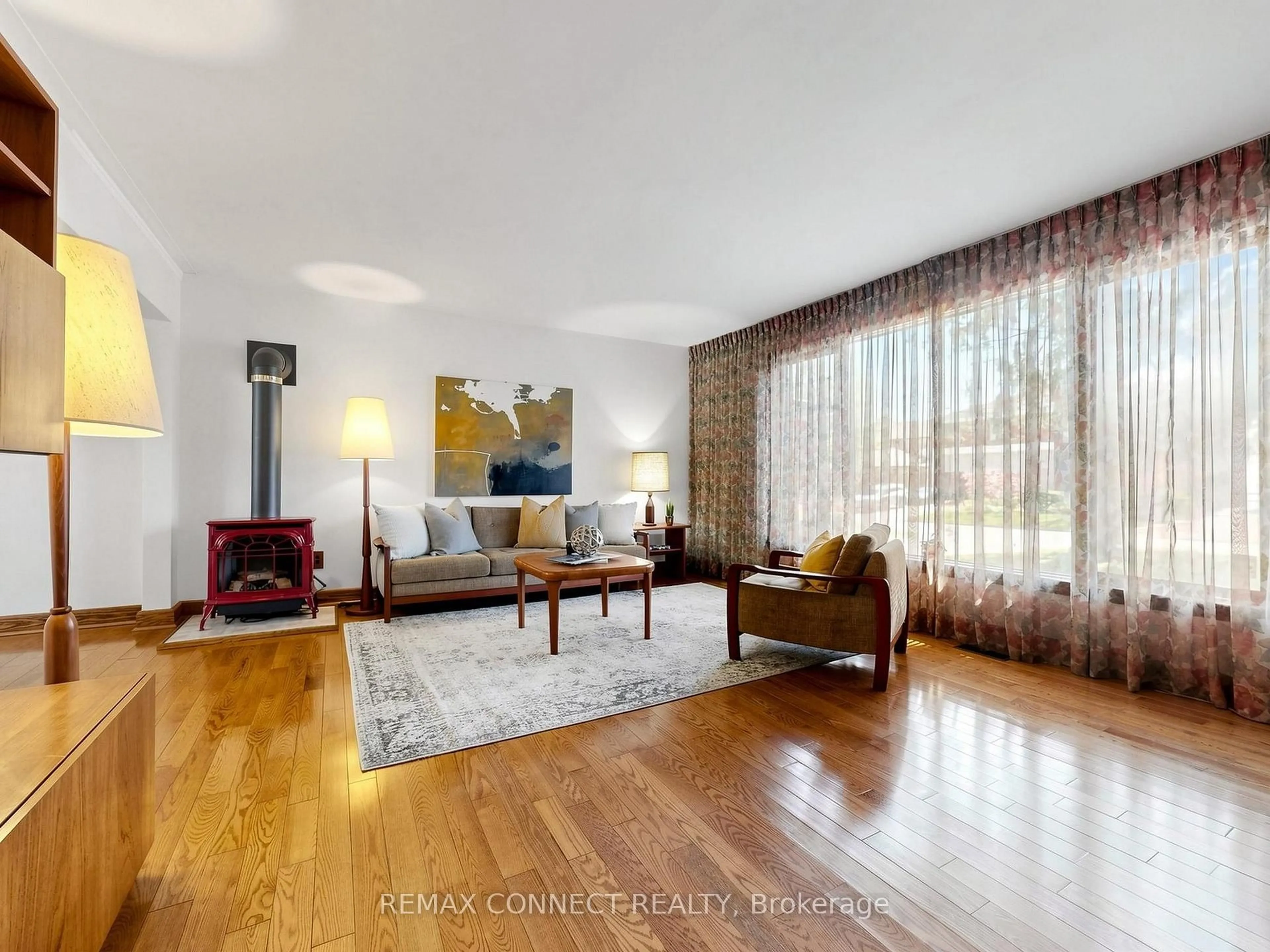 Living room with furniture, wood/laminate floor for 90 Sylvan Ave, Toronto Ontario M1M 1K1