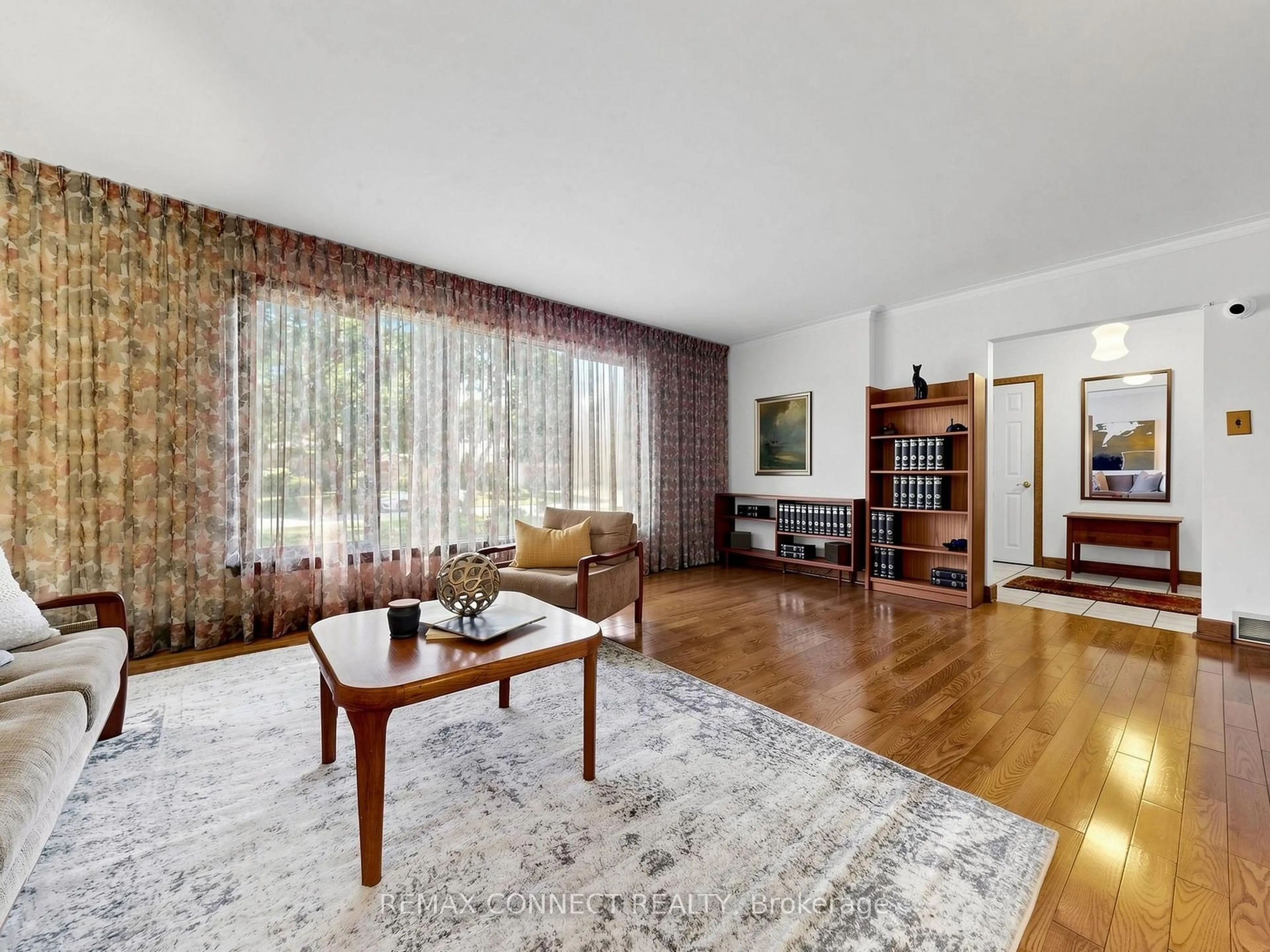 Living room with furniture, wood/laminate floor for 90 Sylvan Ave, Toronto Ontario M1M 1K1