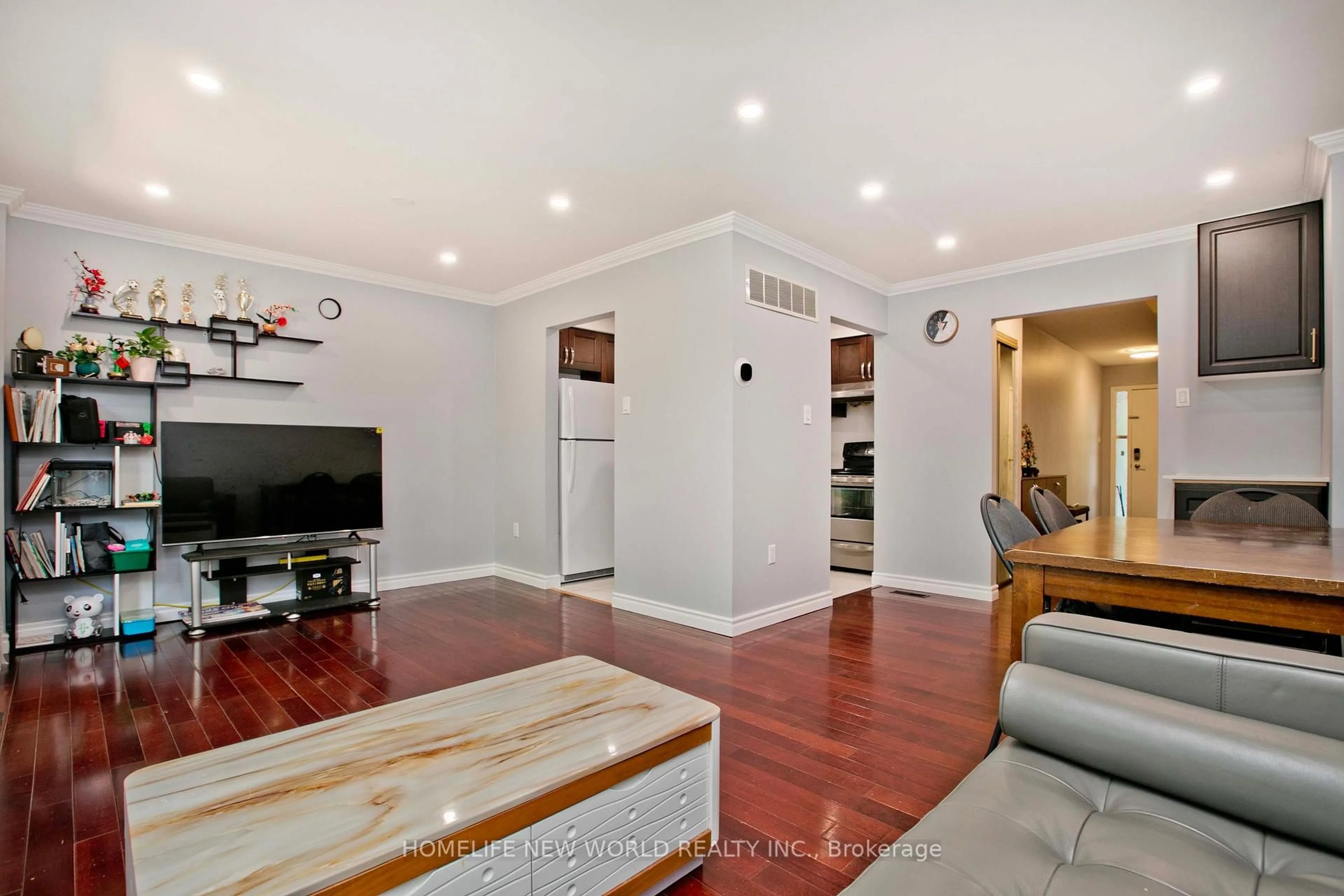 Living room with furniture, wood/laminate floor for 1180 Sandhurst Circ #7, Toronto Ontario M1V 1T8