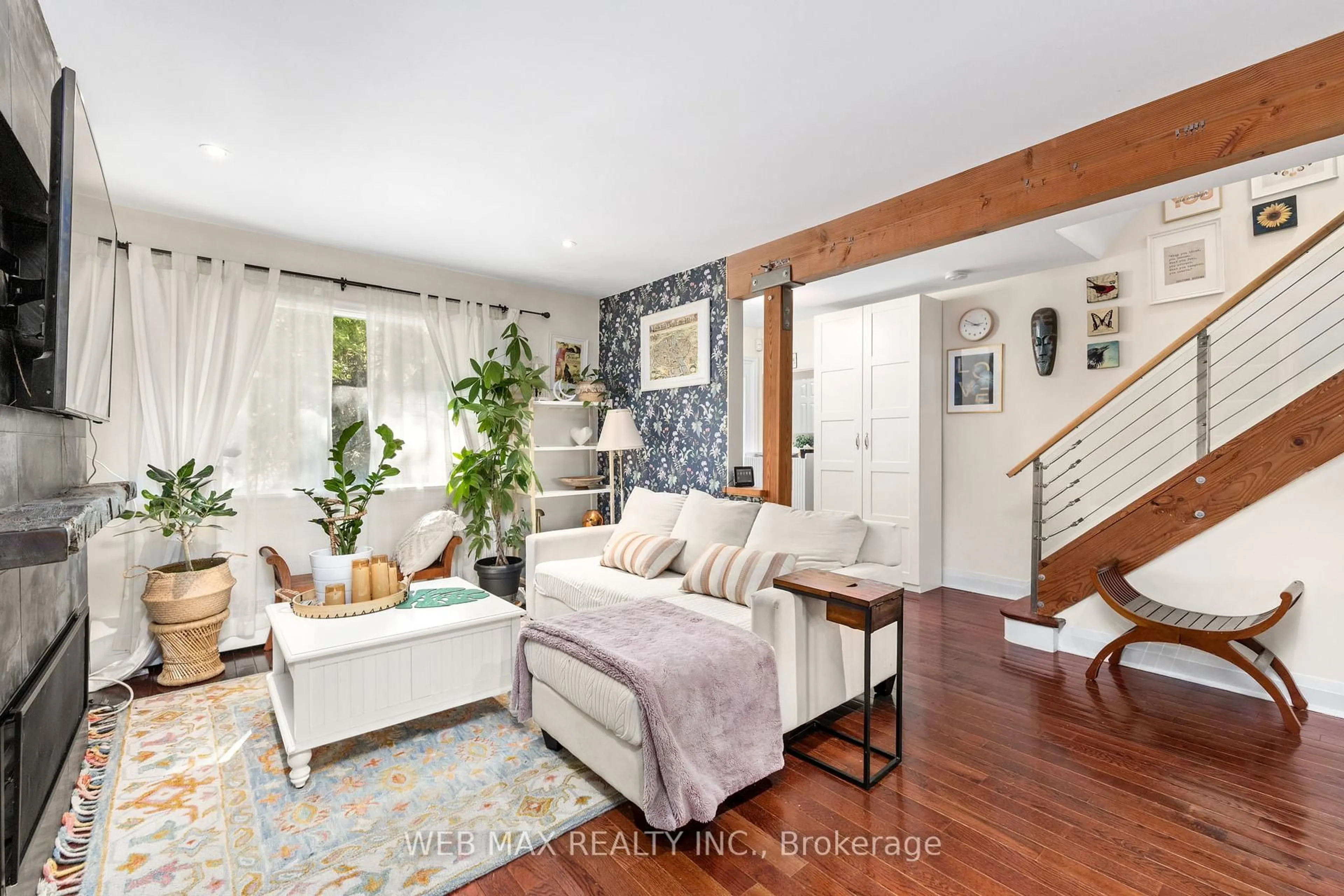 Living room with furniture, wood/laminate floor for 18 Bellefair Ave, Toronto Ontario M4L 3T8