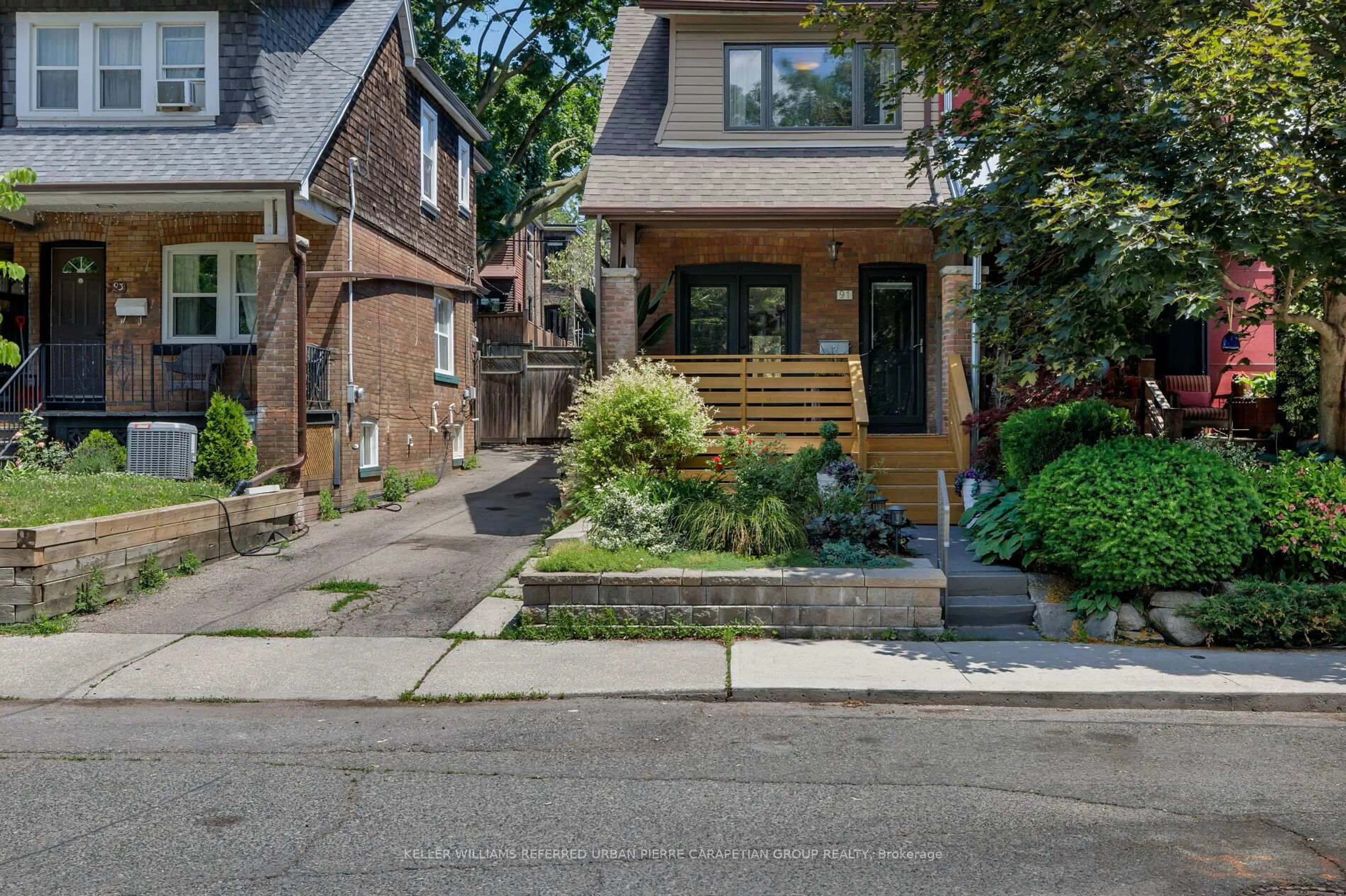 Home with brick exterior material, street for 91 Hiltz Ave, Toronto Ontario M4L 2N7