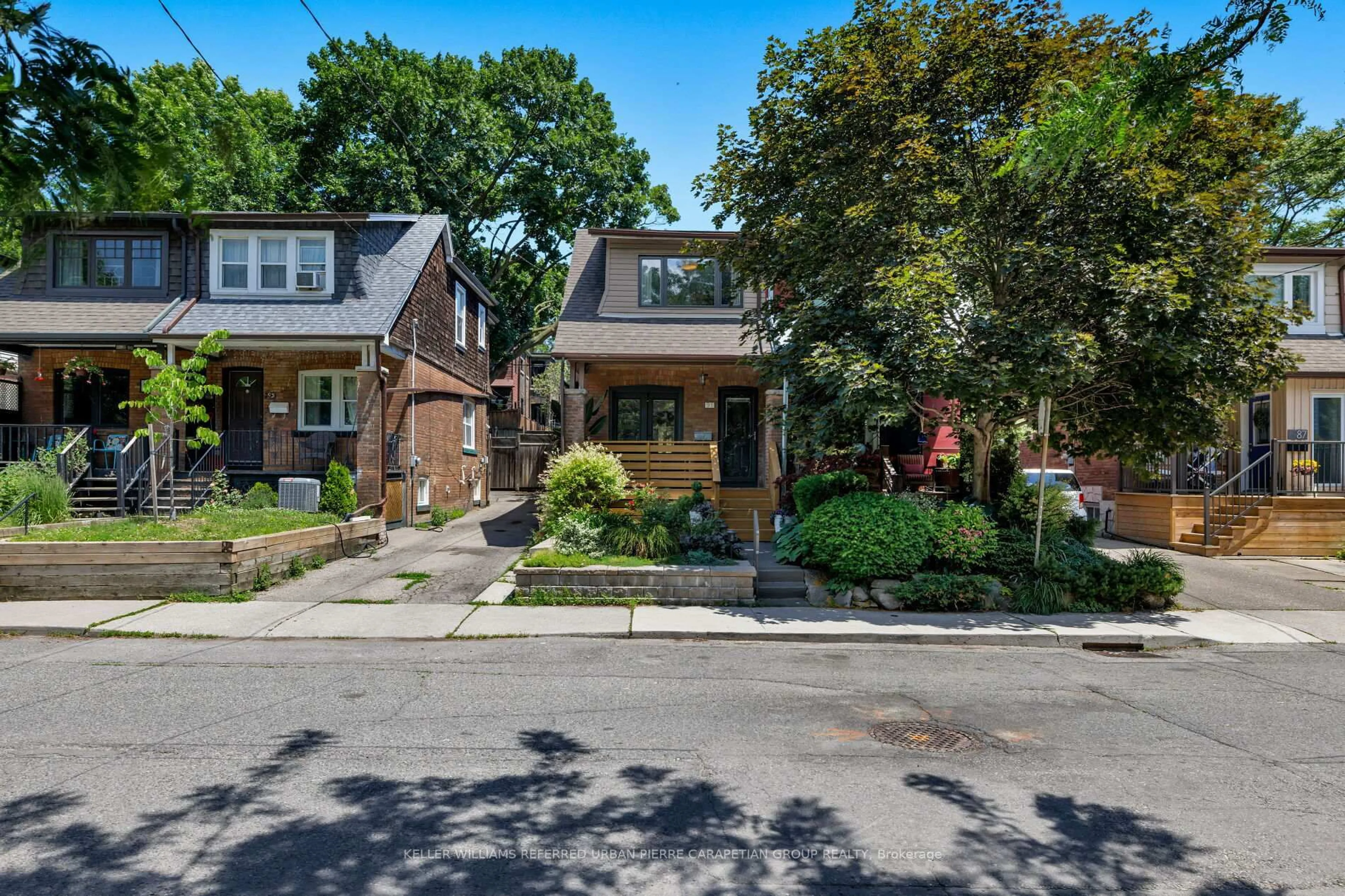 Home with brick exterior material, street for 91 Hiltz Ave, Toronto Ontario M4L 2N7