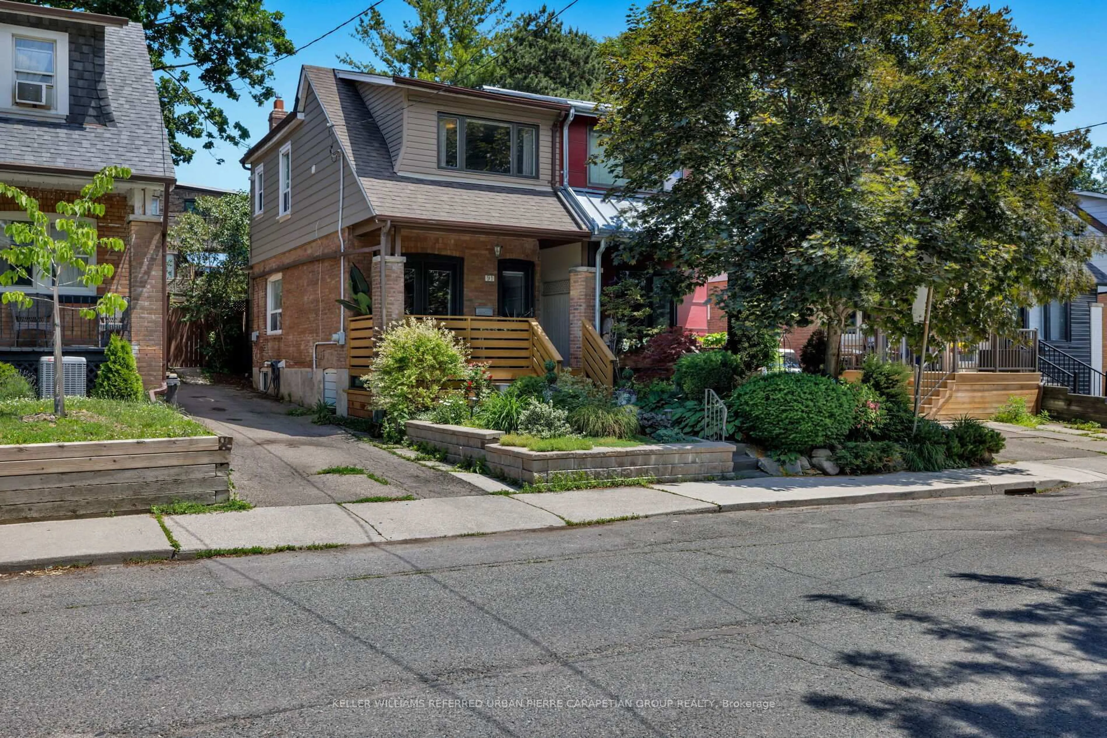 Home with brick exterior material, street for 91 Hiltz Ave, Toronto Ontario M4L 2N7