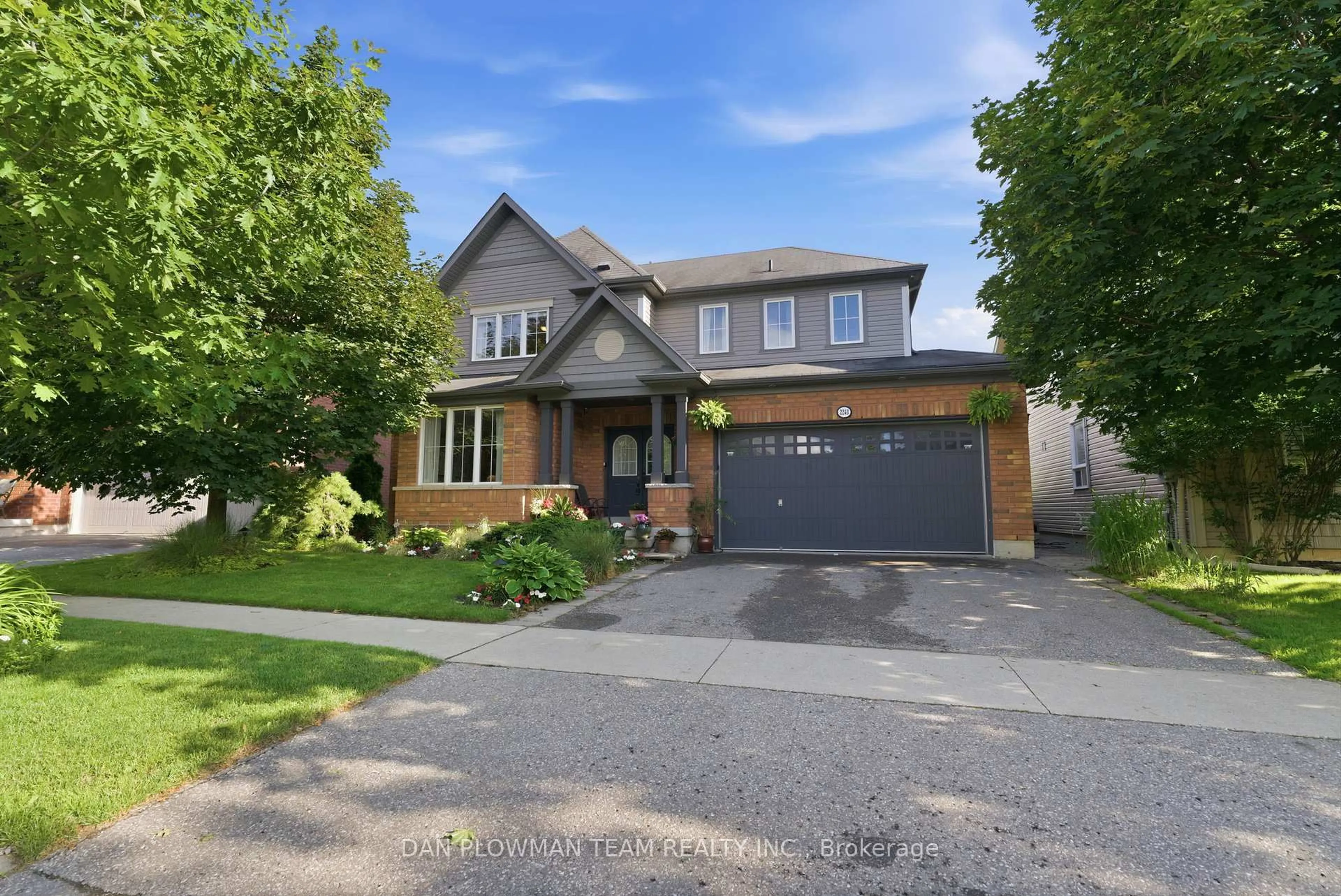 Home with brick exterior material, street for 2243 Pilgrim Sq, Oshawa Ontario L1L 0B5