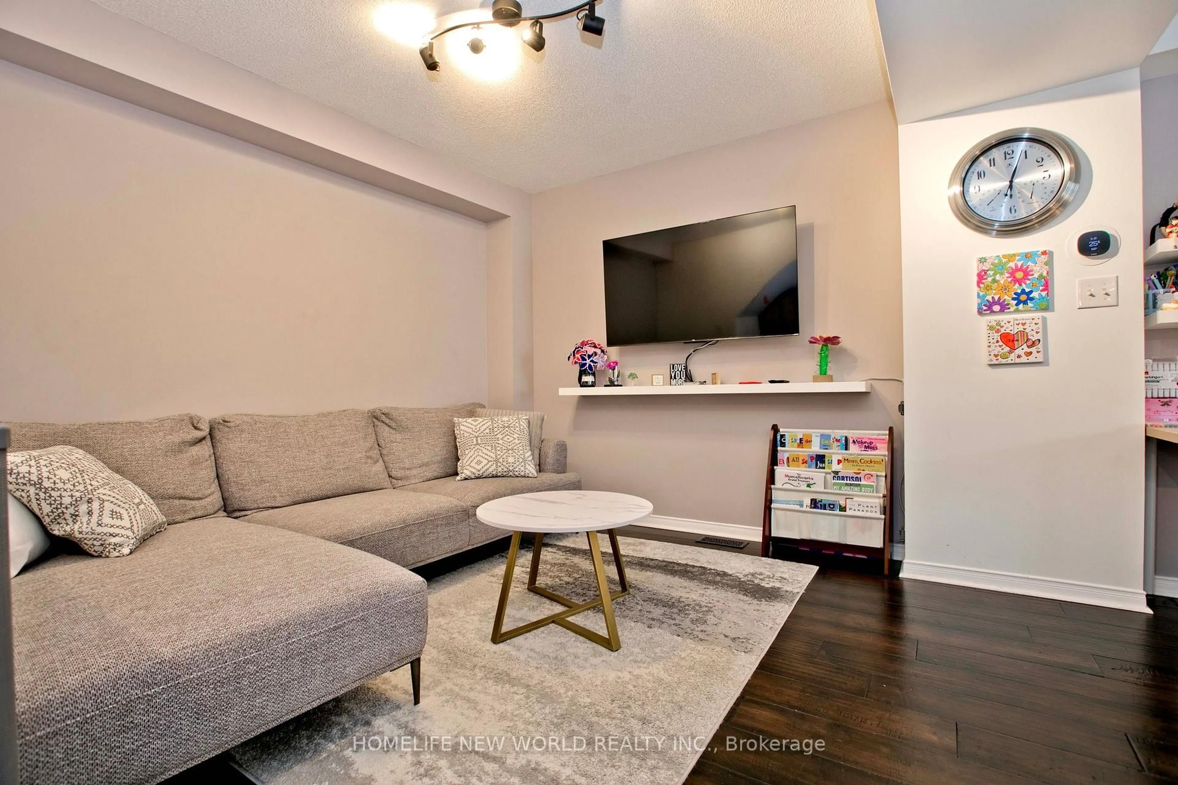 Living room with furniture, wood/laminate floor for 30 Linnell St, Ajax Ontario L1Z 0K8