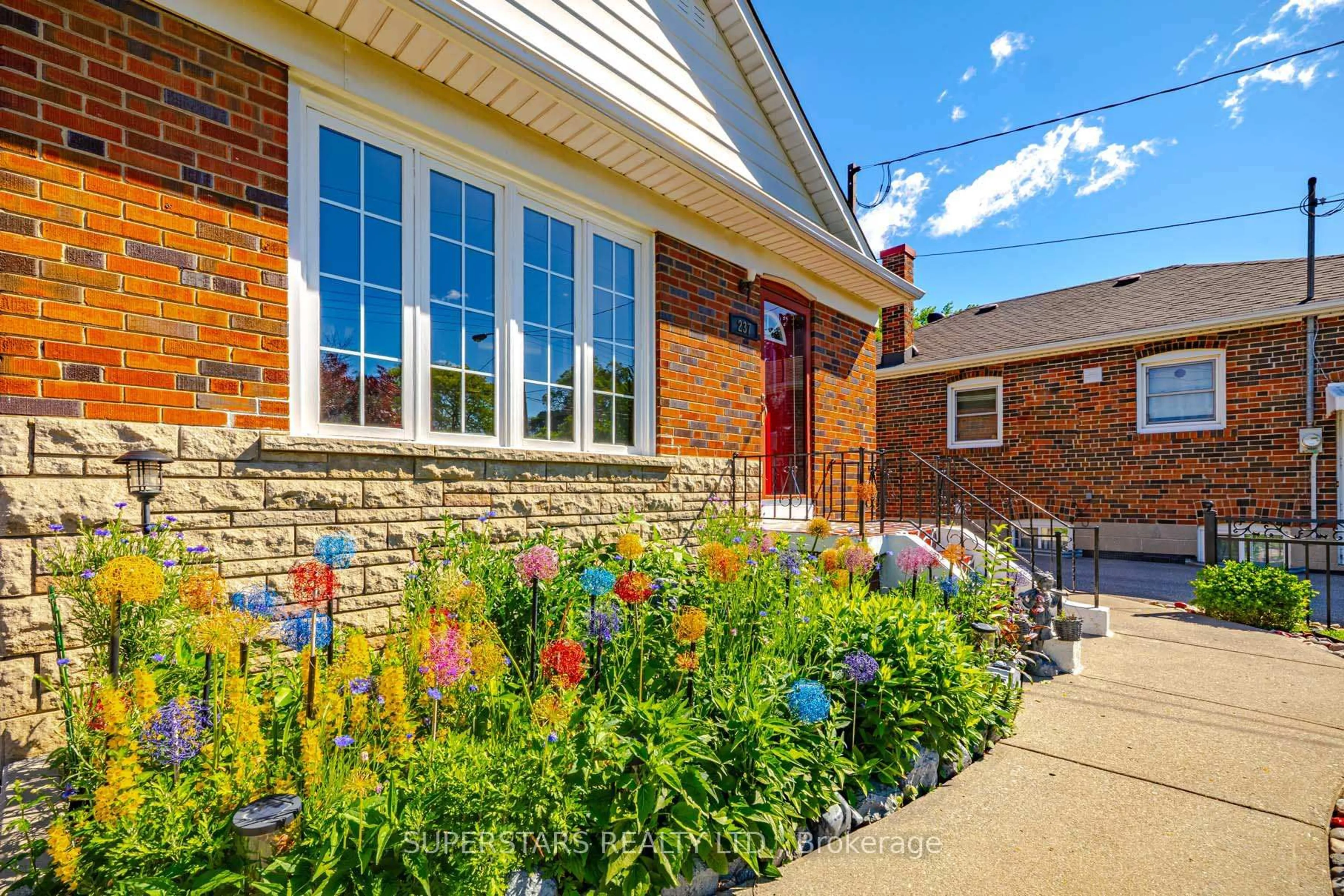 Home with brick exterior material, street for 237 Ellington Dr, Toronto Ontario M1R 3Y2