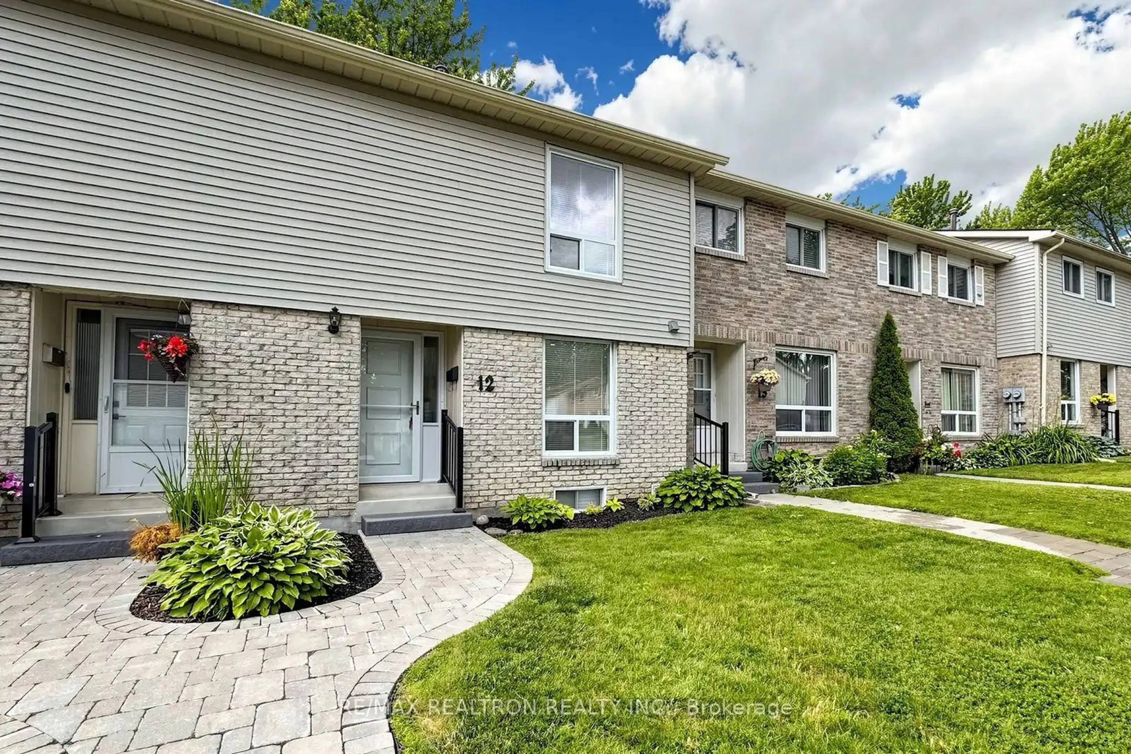 Home with brick exterior material, street for 611 Galahad Dr #12, Oshawa Ontario L1K 1M1