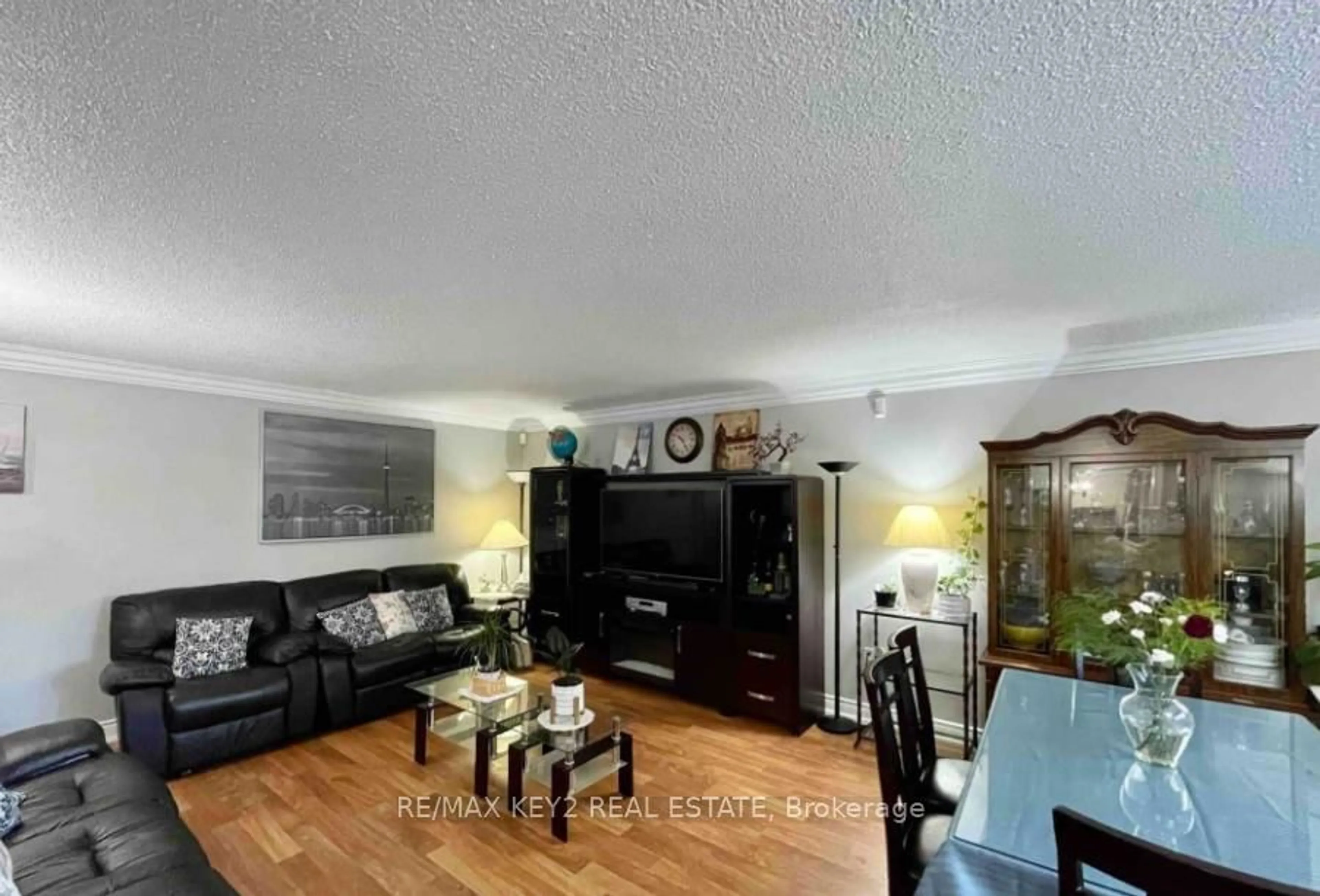 Living room with furniture, wood/laminate floor for 140 Ling Rd #88, Toronto Ontario M1E 4V9