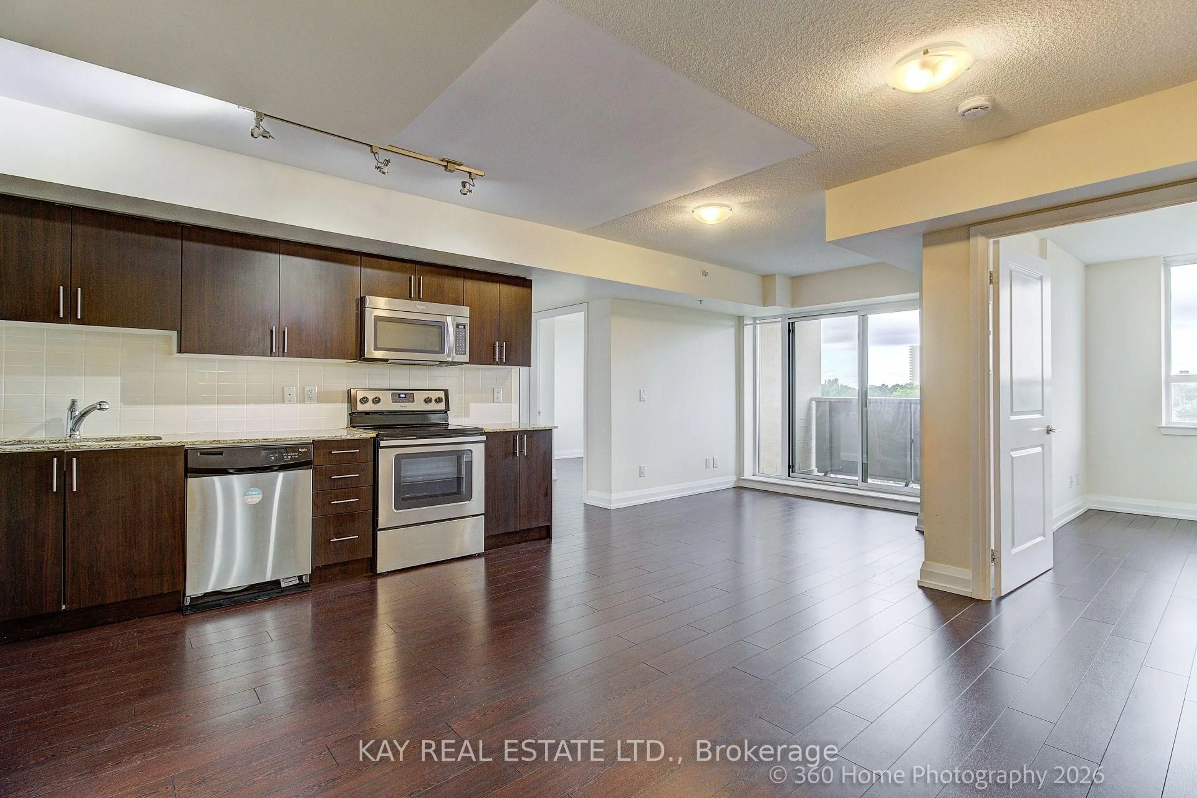 Open concept kitchen, wood/laminate floor for 3520 Danforth Ave #612, Toronto Ontario M1L 1E5