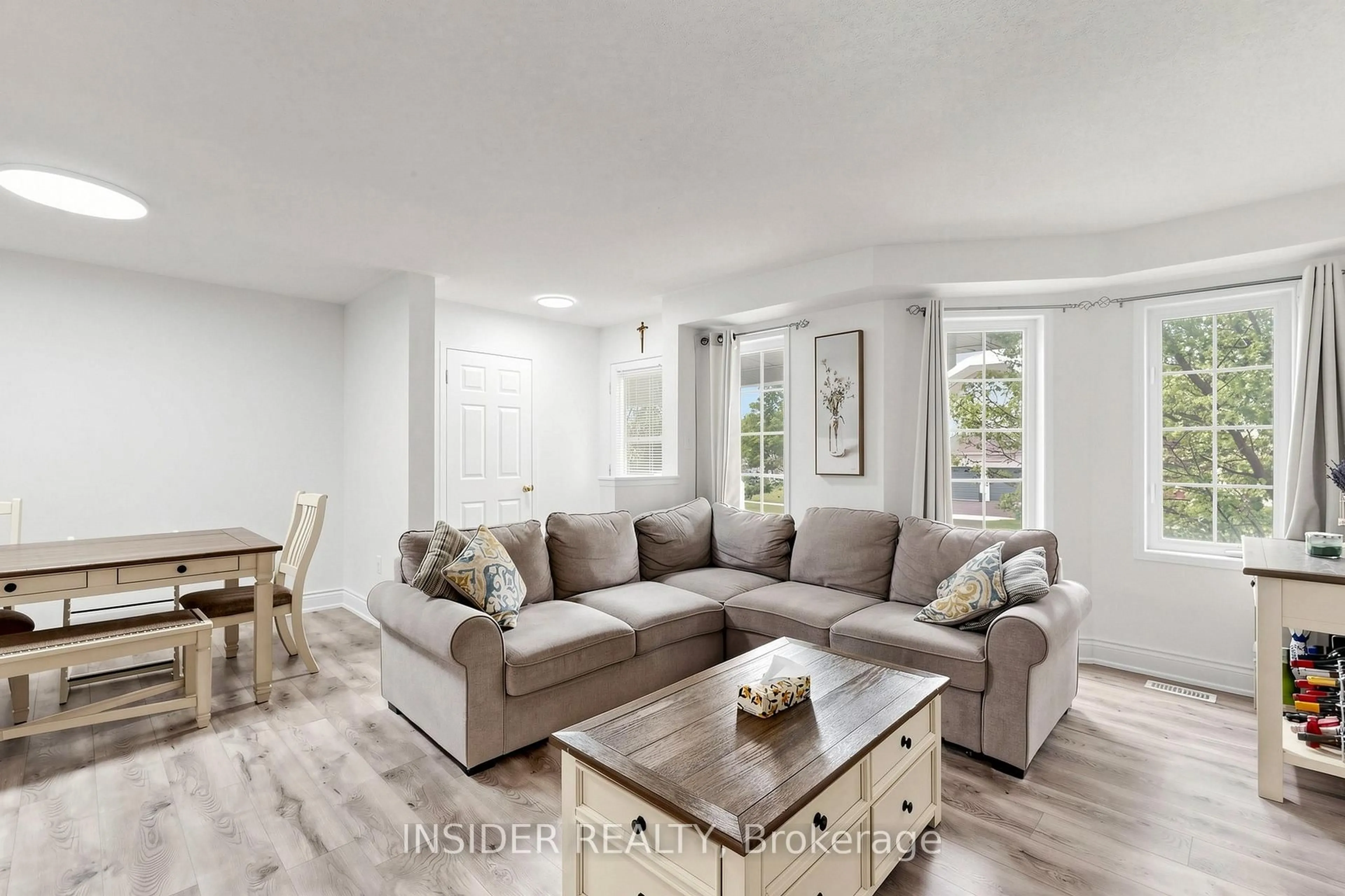 Living room with furniture, wood/laminate floor for 7 Croxall Blvd, Whitby Ontario L1M 0E6