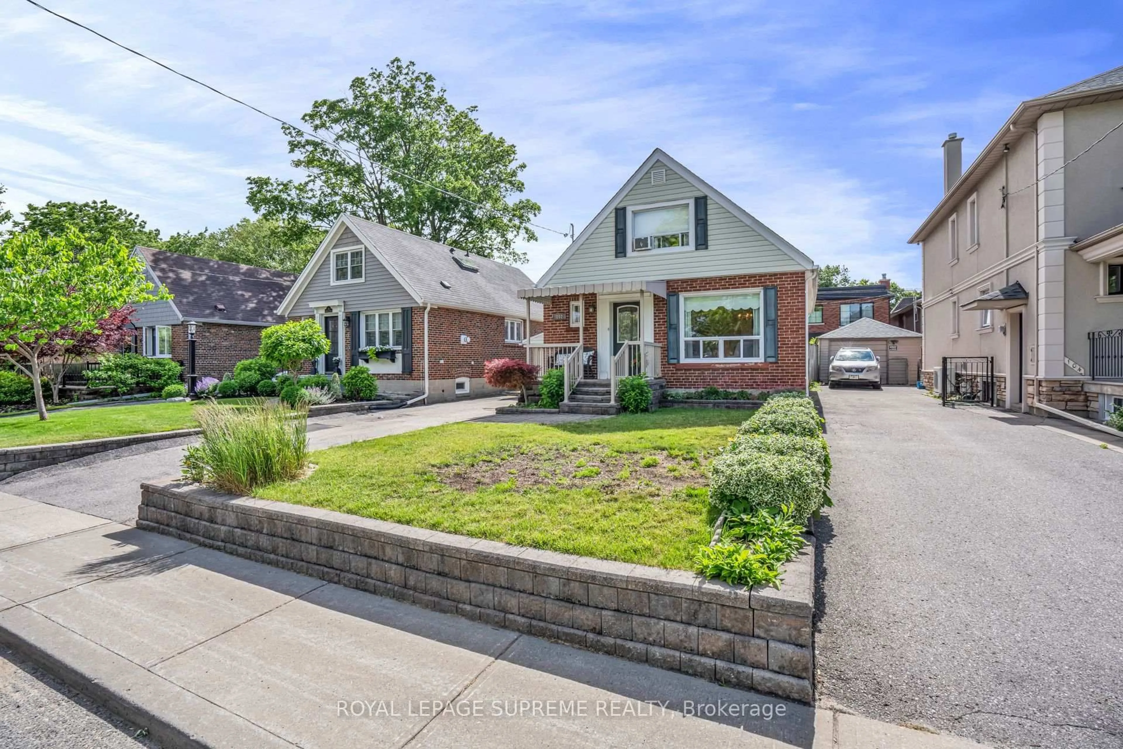 Home with brick exterior material, street for 102 Binswood Ave, Toronto Ontario M4C 3N9