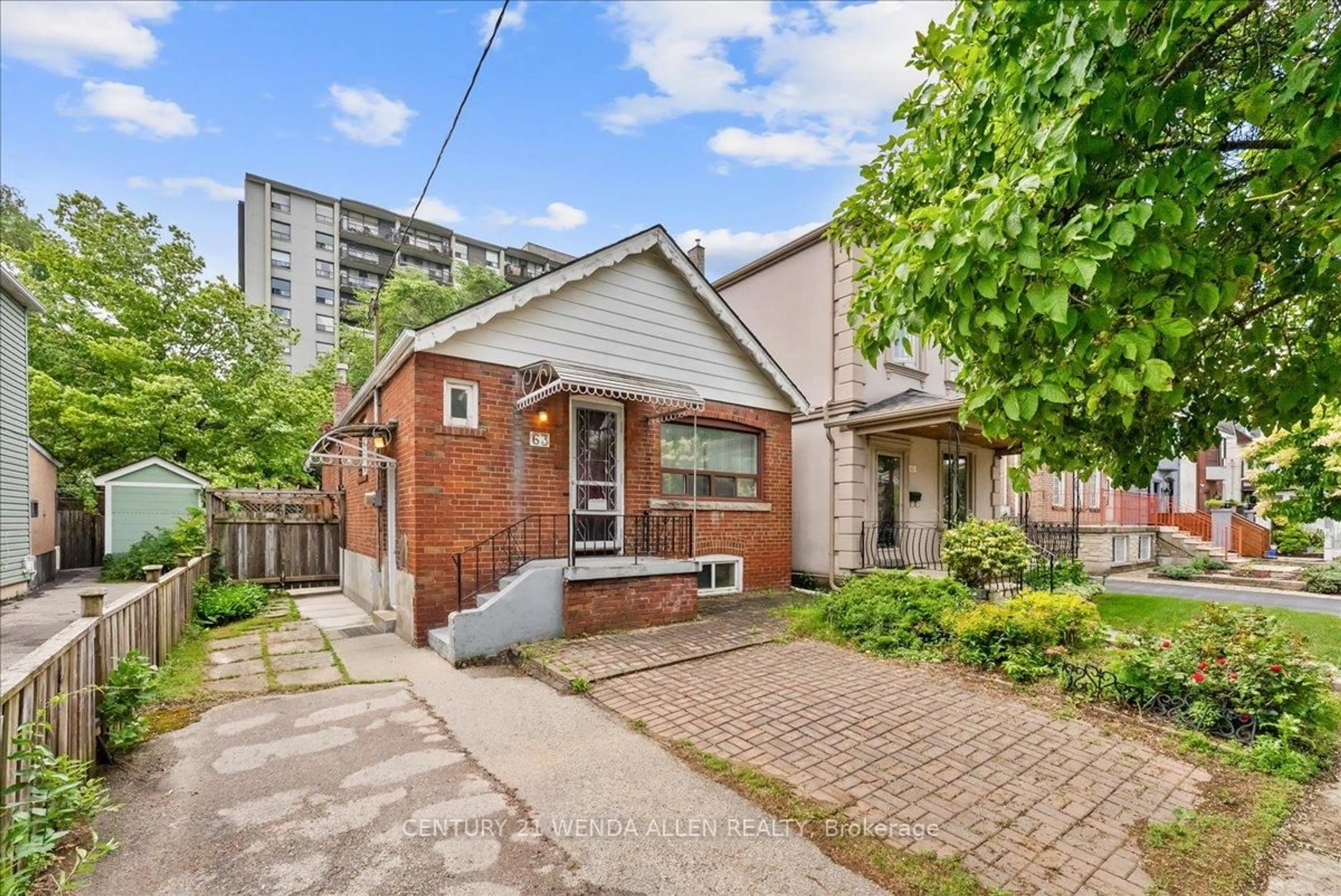 Home with brick exterior material, street for 63 Torrens Ave, Toronto Ontario M4K 2H9