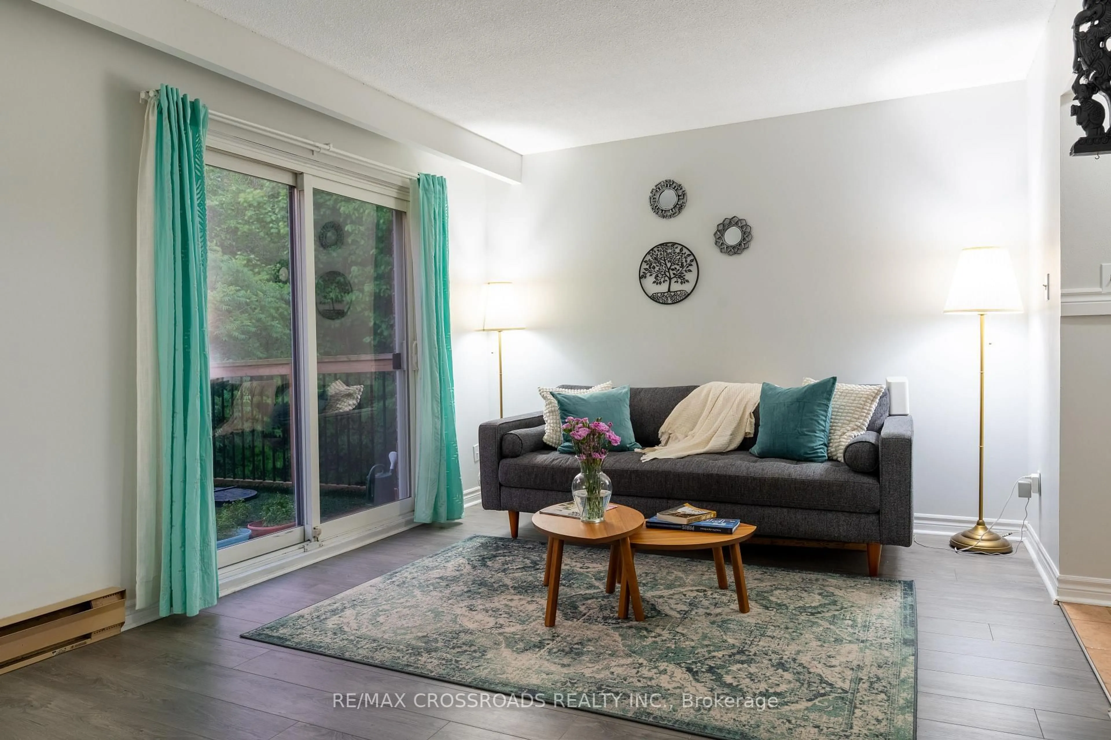 Living room with furniture, wood/laminate floor for 350 Camelot Crt #30, Oshawa Ontario L1G 6P7