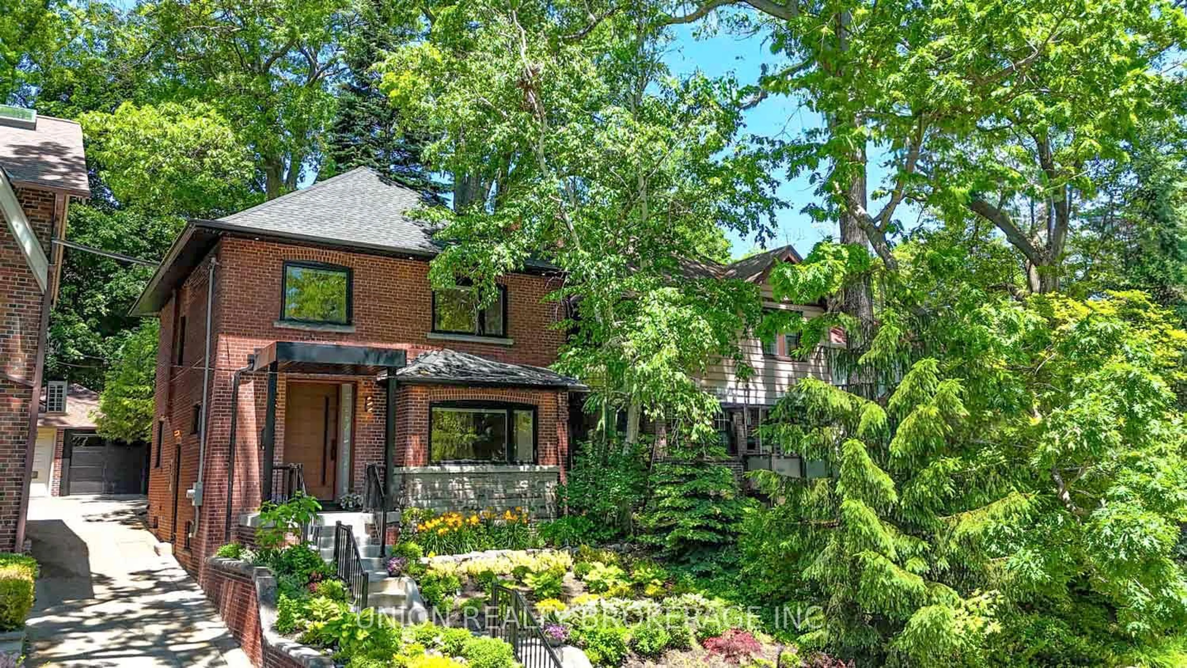 Home with brick exterior material, street for 50 Beaufort Rd, Toronto Ontario M4E 1M7
